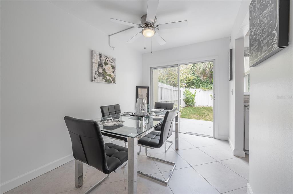 3206 West Azeele Street, Unit 129 Tampa, FL 33609 - Photo 9 of 30 a view of a dining room with furniture window and outside view