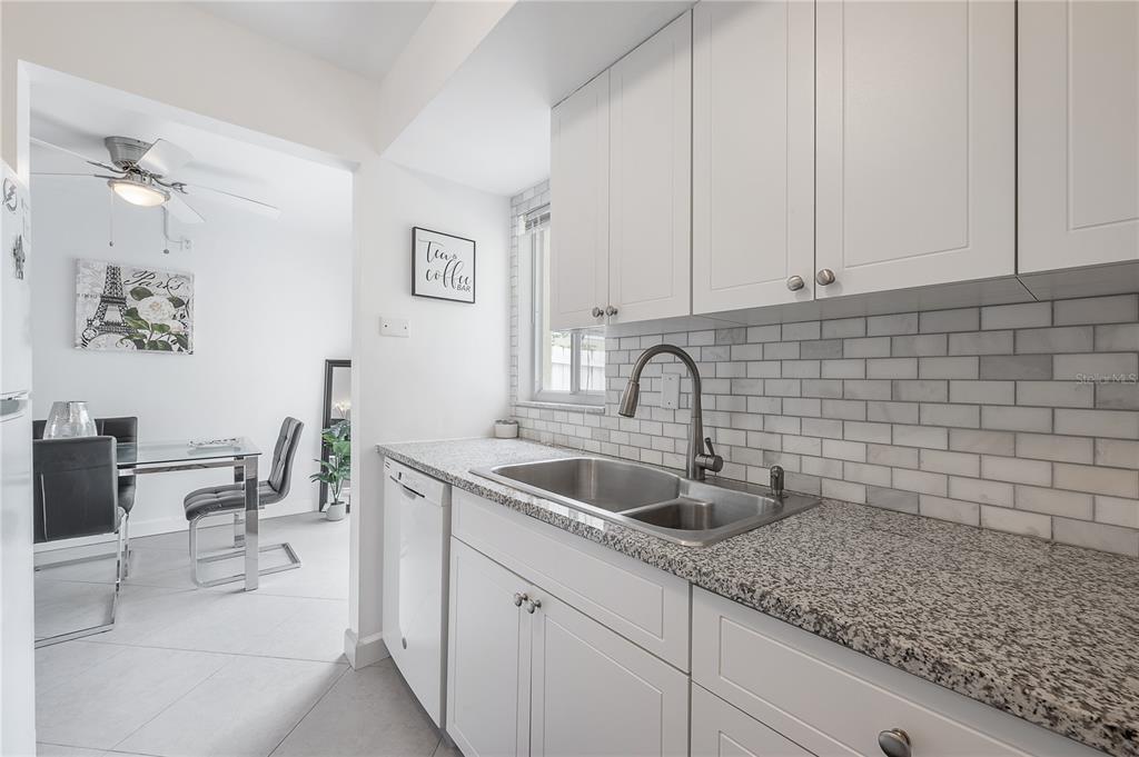 3206 West Azeele Street, Unit 129 Tampa, FL 33609 - Photo 10 of 30 a kitchen with a sink and cabinets