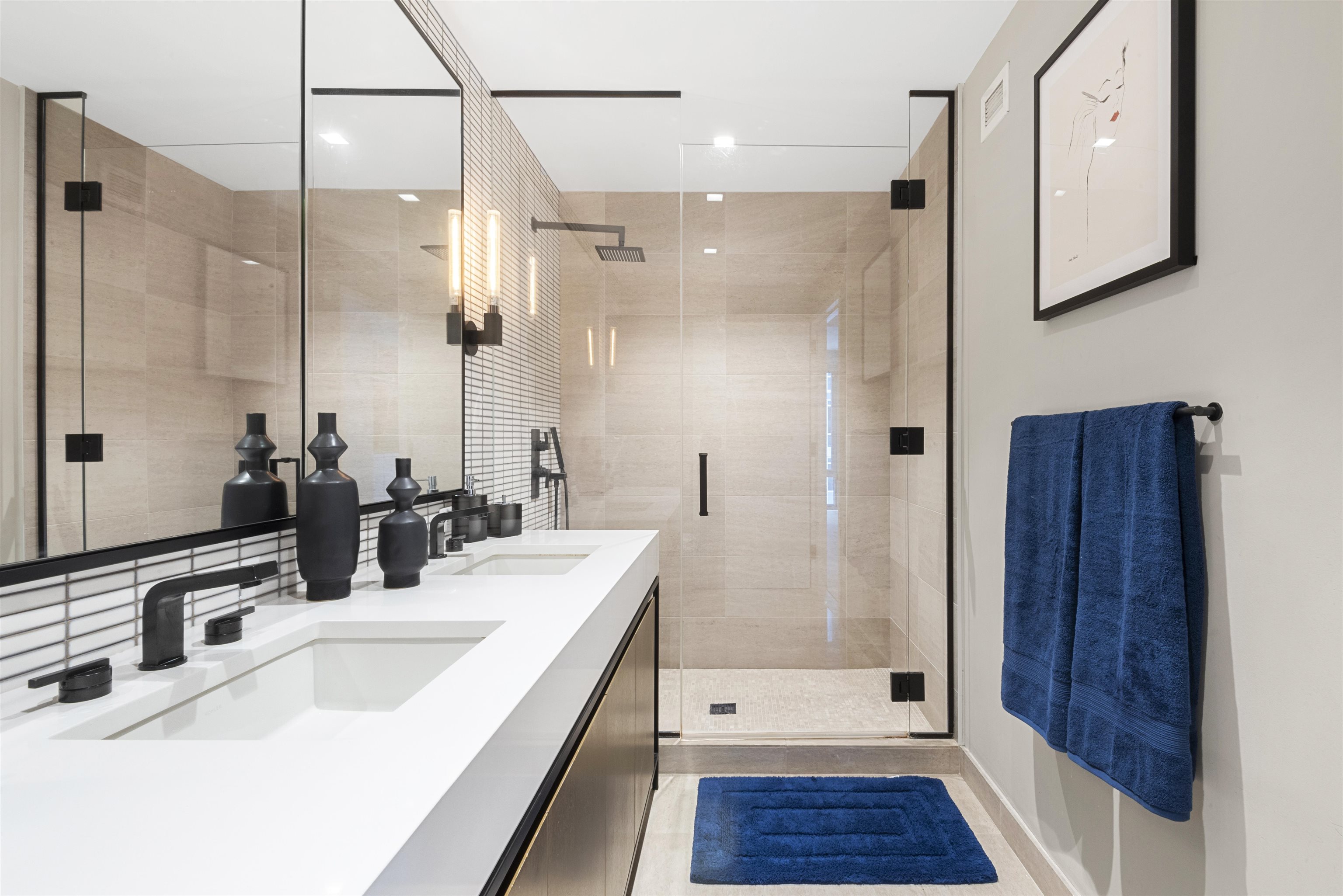 2 Shore Lane, Unit 404 Jersey City, NJ 07310 - Photo 13 of 34 a bathroom with a double vanity sink a mirror and shower