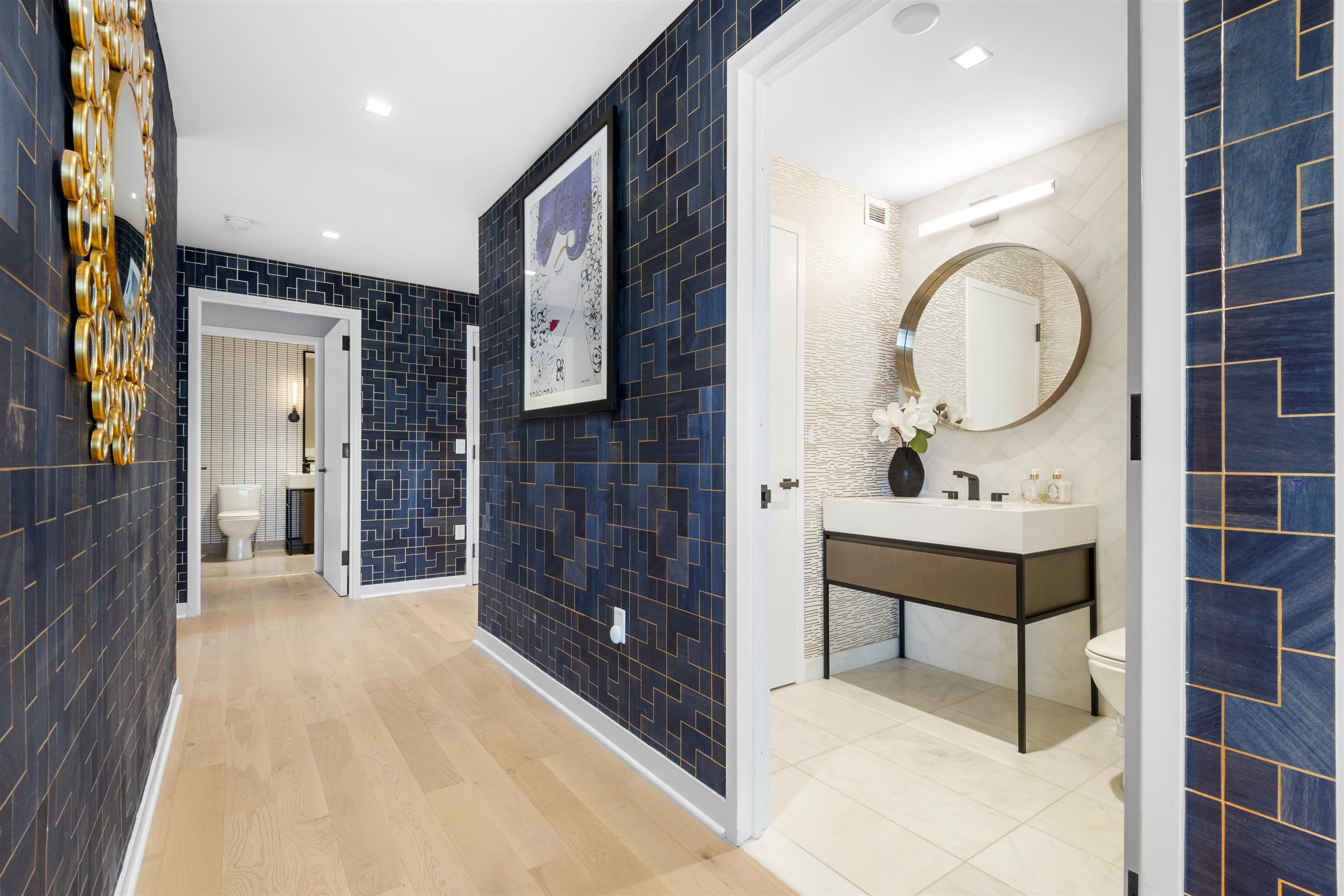 2 Shore Lane, Unit 404 Jersey City, NJ 07310 - Photo 14 of 34 a view of a bathroom with a sink and a mirror