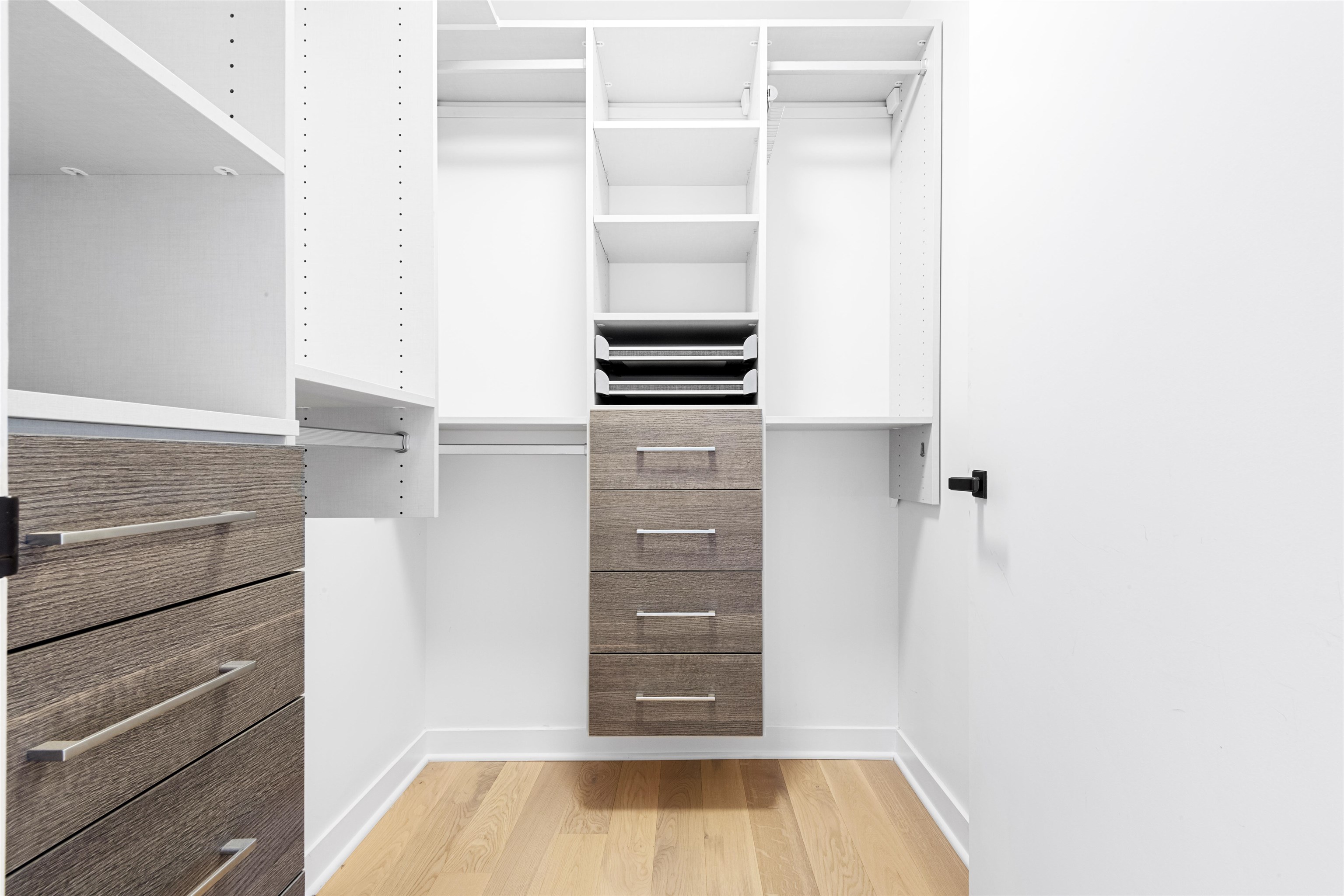 2 Shore Lane, Unit 404 Jersey City, NJ 07310 - Photo 17 of 34 a view of walk in closet with clothes