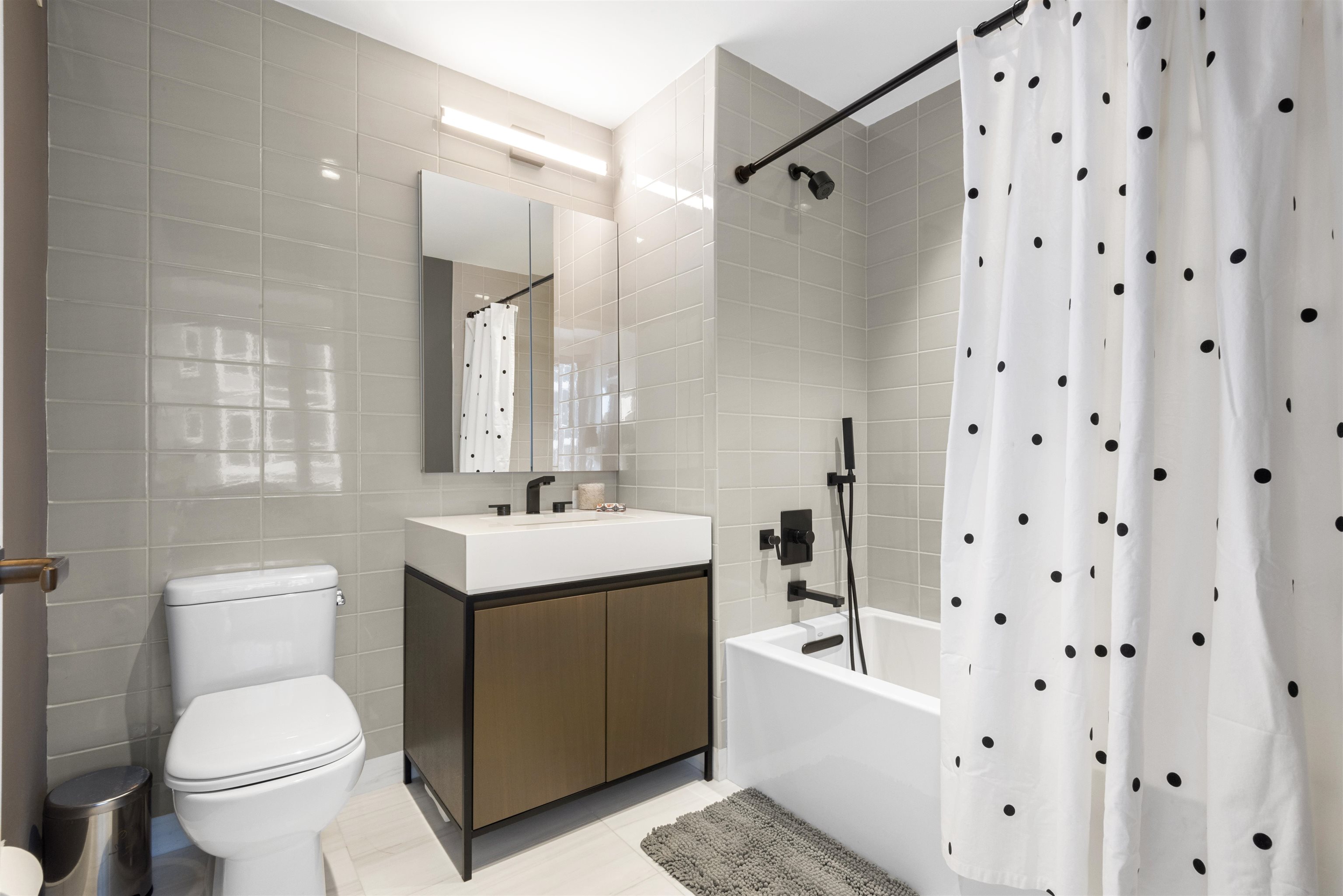 2 Shore Lane, Unit 404 Jersey City, NJ 07310 - Photo 20 of 34 a bathroom with a sink toilet and shower