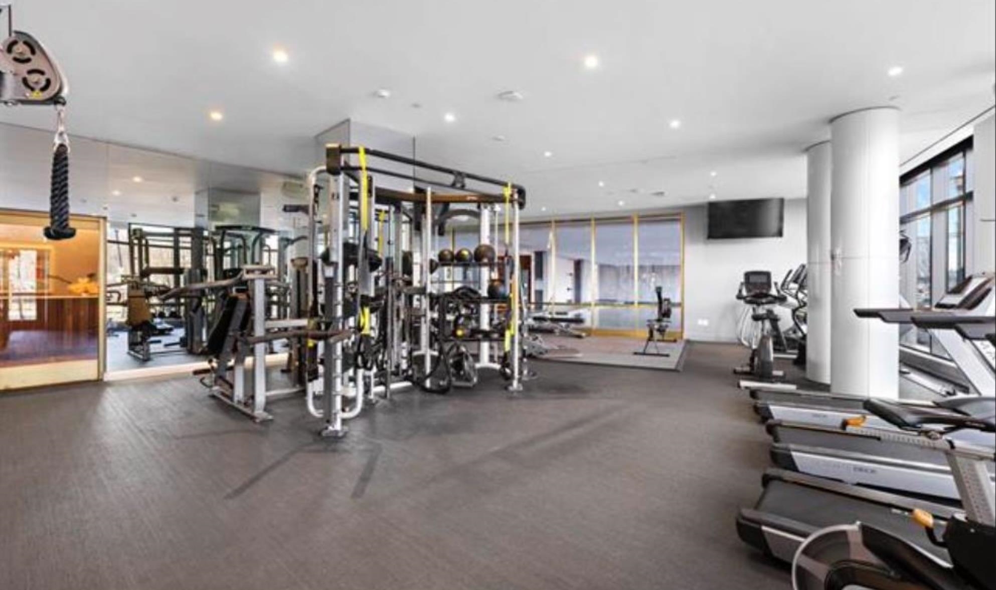 2 Shore Lane, Unit 404 Jersey City, NJ 07310 - Photo 29 of 34 a view of a room with gym equipment
