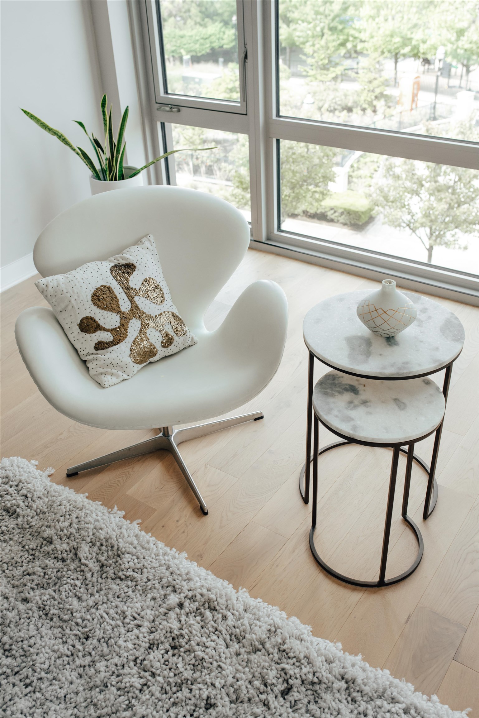 2 Shore Lane, Unit 404 Jersey City, NJ 07310 - Photo 4 of 34 a view of a living room with a floor to ceiling window and wooden floor