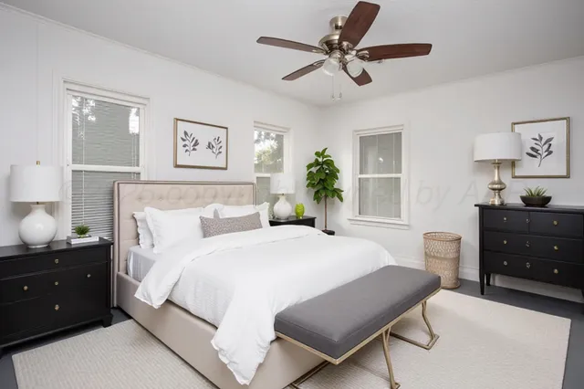 a bedroom with a bed and a dresser