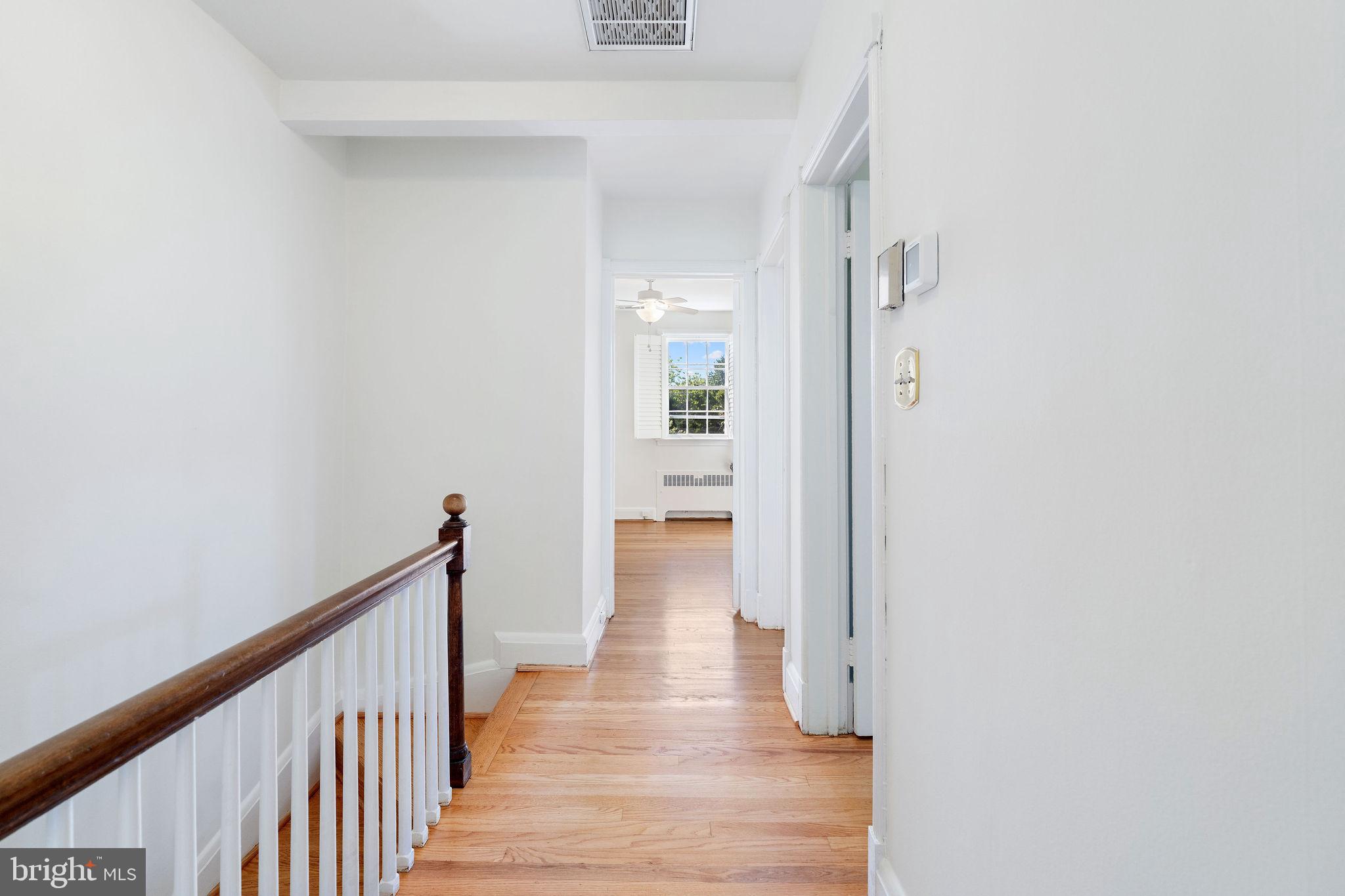 19 Dunkirk Road Baltimore, MD 21212 - Photo 14 of 37 a view of a hallway with wooden floor