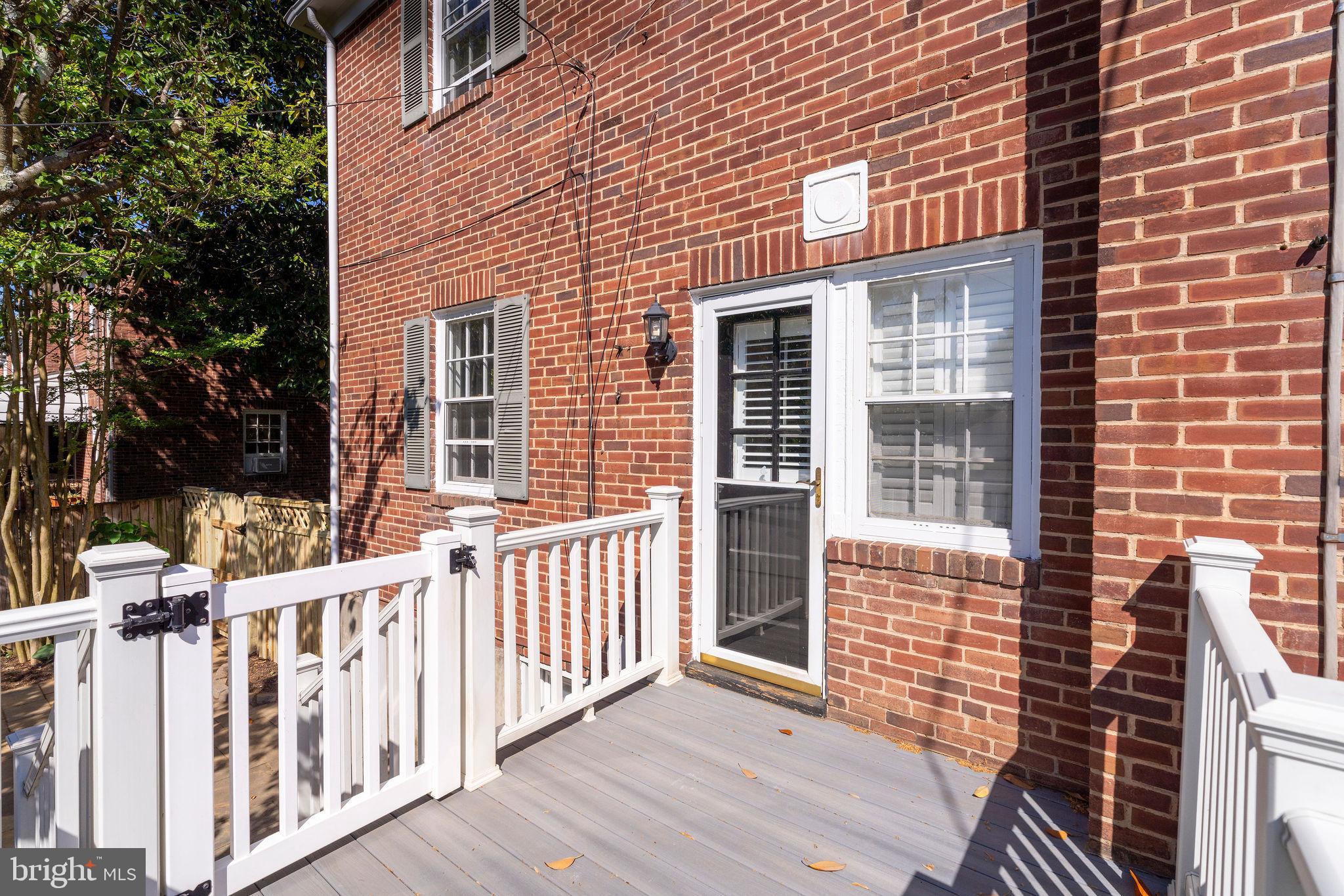 19 Dunkirk Road Baltimore, MD 21212 - Photo 32 of 37 a view of a brick house with wooden fence
