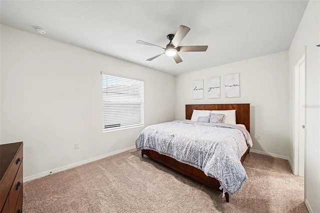 a bathroom with a sink mirror and a bathtub