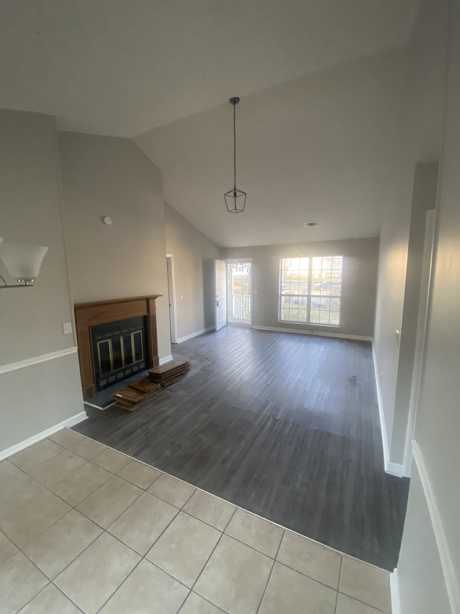 2925 Sheana Way Antioch, TN 37013 - Photo 2 of 7 a view of an empty room with wooden floor and a window