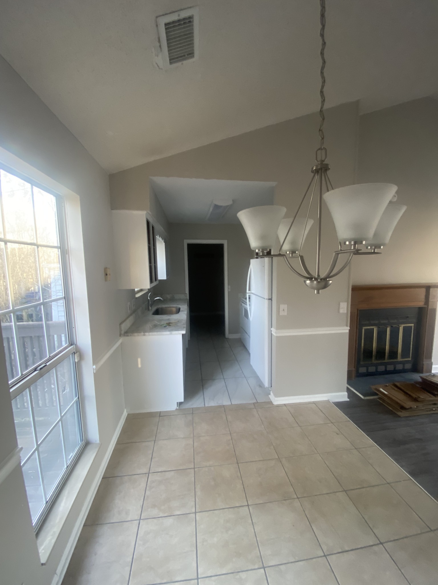 2925 Sheana Way Antioch, TN 37013 - Photo 4 of 7 a view of a refrigerator in kitchen and an empty room