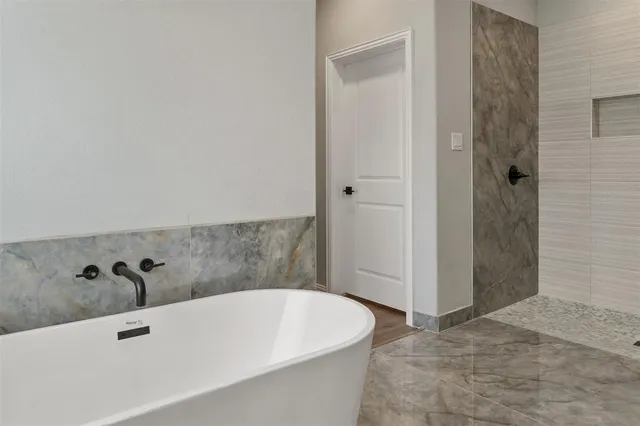 a hallway with a sink and a mirror