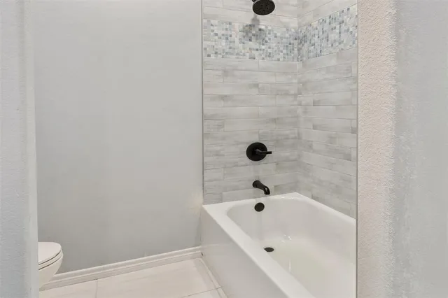 a view of backyard with trampoline