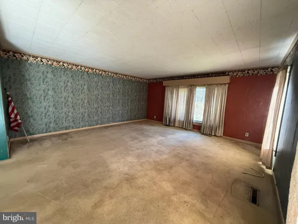 an empty room with windows