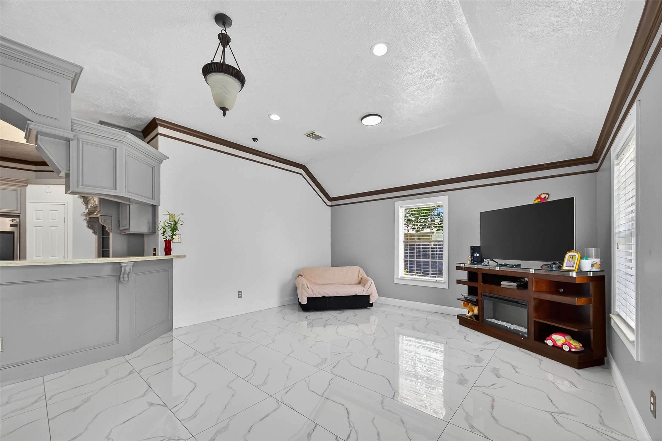 4917 Sycamore Avenue Pasadena, TX 77503 - Photo 11 of 46 a living room with furniture and a flat screen tv