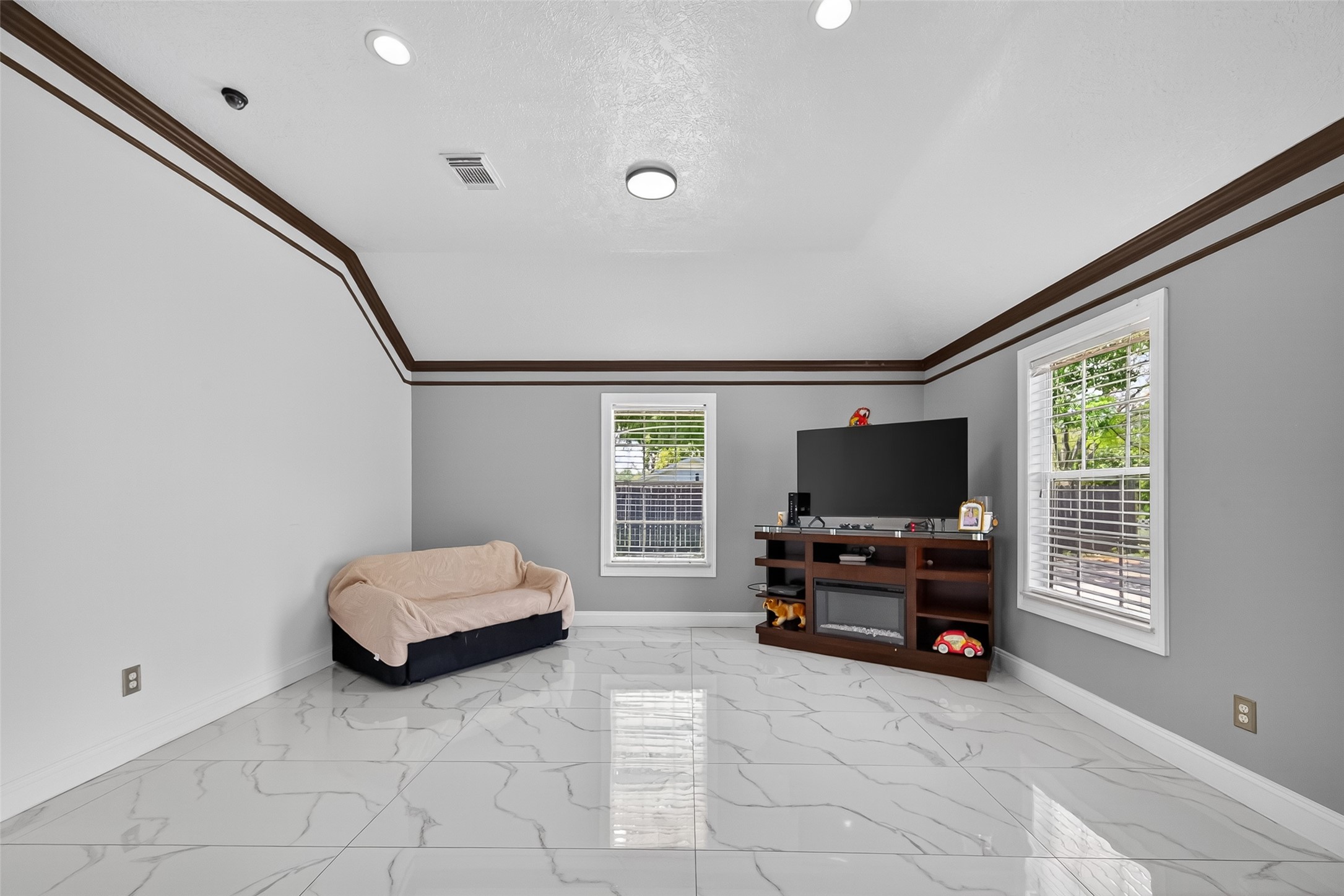 4917 Sycamore Avenue Pasadena, TX 77503 - Photo 12 of 46 a living room with furniture and a flat screen tv