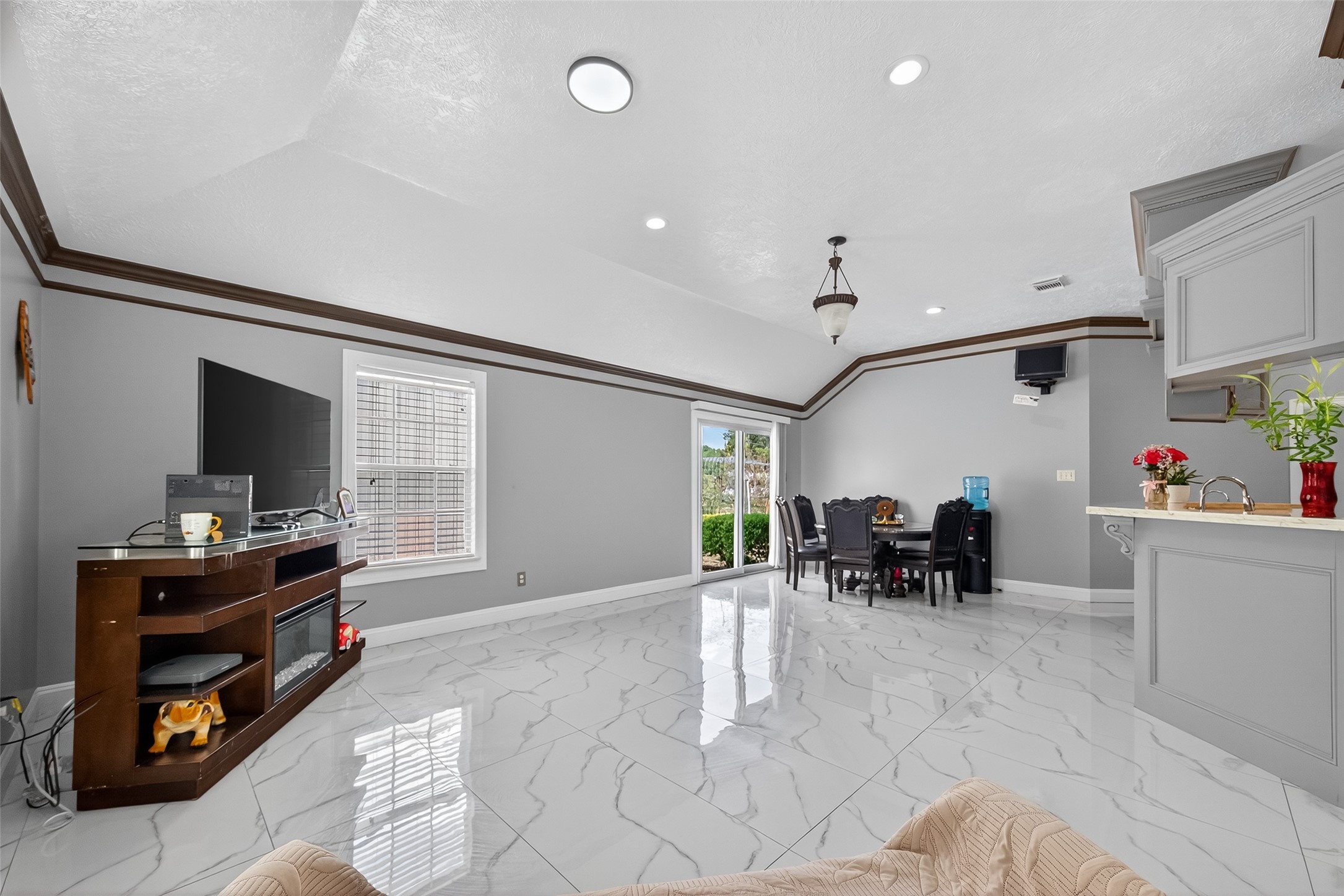 4917 Sycamore Avenue Pasadena, TX 77503 - Photo 13 of 46 a living room with furniture and a flat screen tv