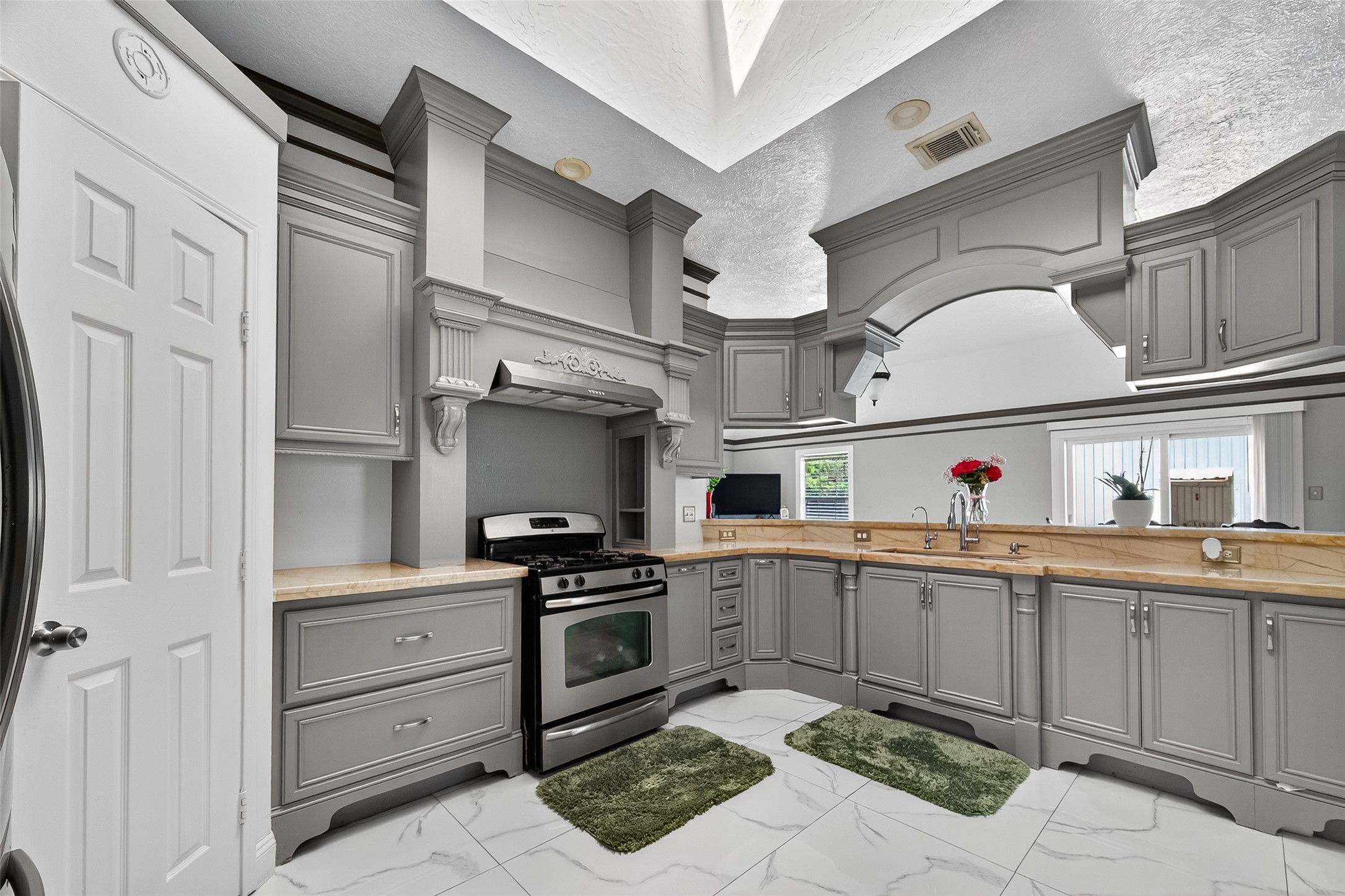 4917 Sycamore Avenue Pasadena, TX 77503 - Photo 18 of 46 a kitchen with cabinets a sink and appliances