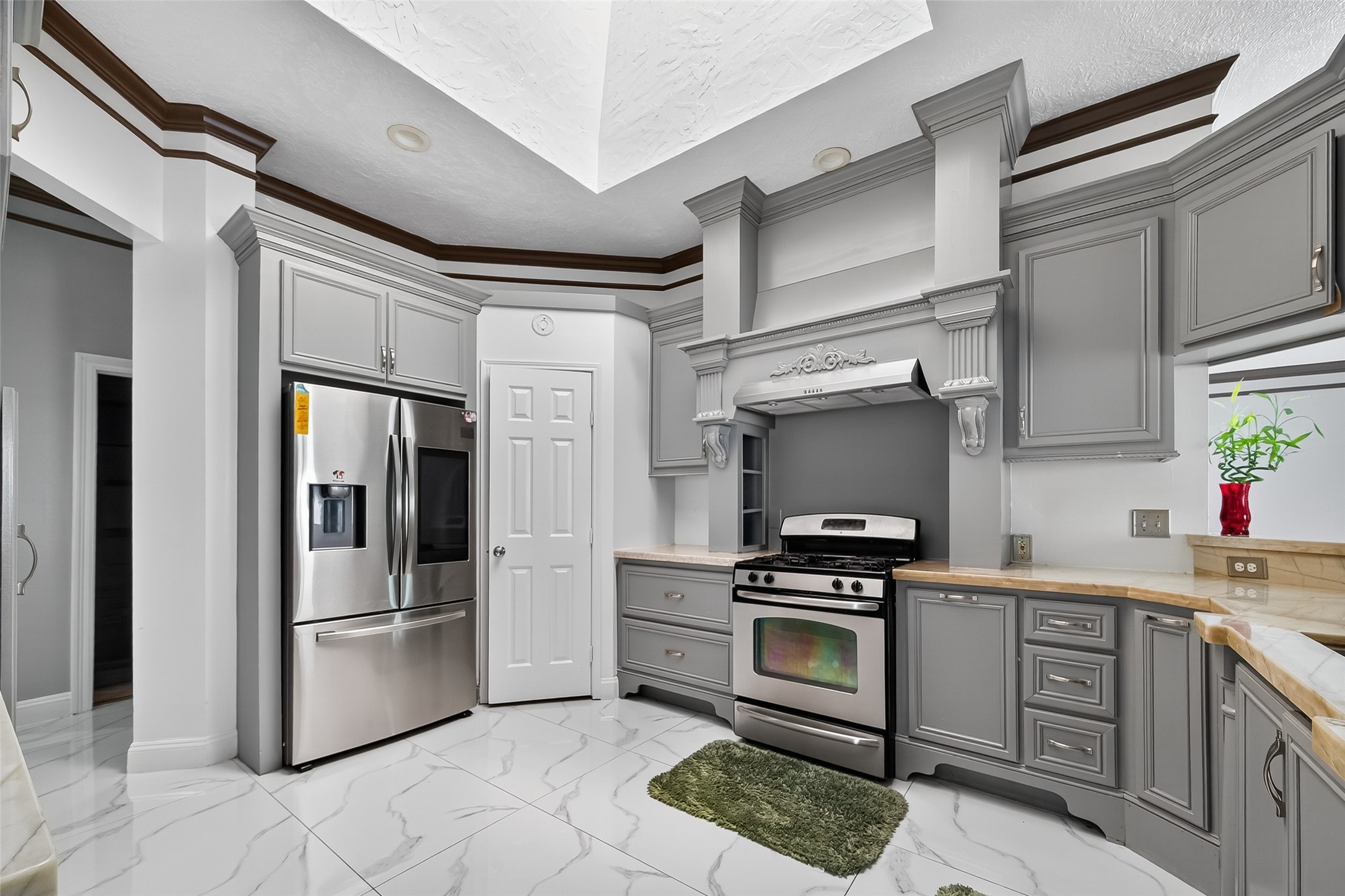 4917 Sycamore Avenue Pasadena, TX 77503 - Photo 19 of 46 a kitchen with cabinets and stainless steel appliances