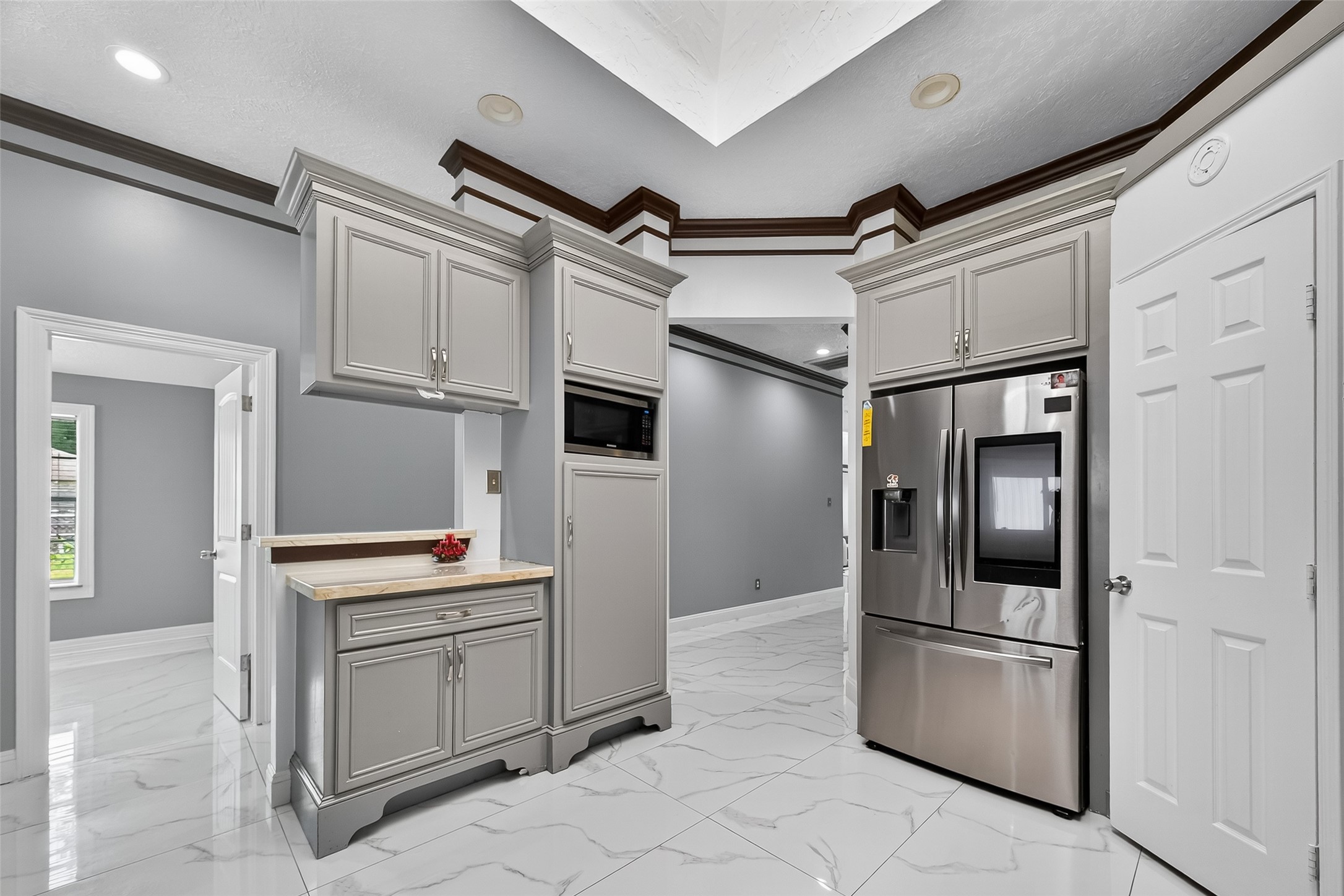 4917 Sycamore Avenue Pasadena, TX 77503 - Photo 21 of 46 a kitchen with stainless steel appliances granite countertop a refrigerator and a stove top oven