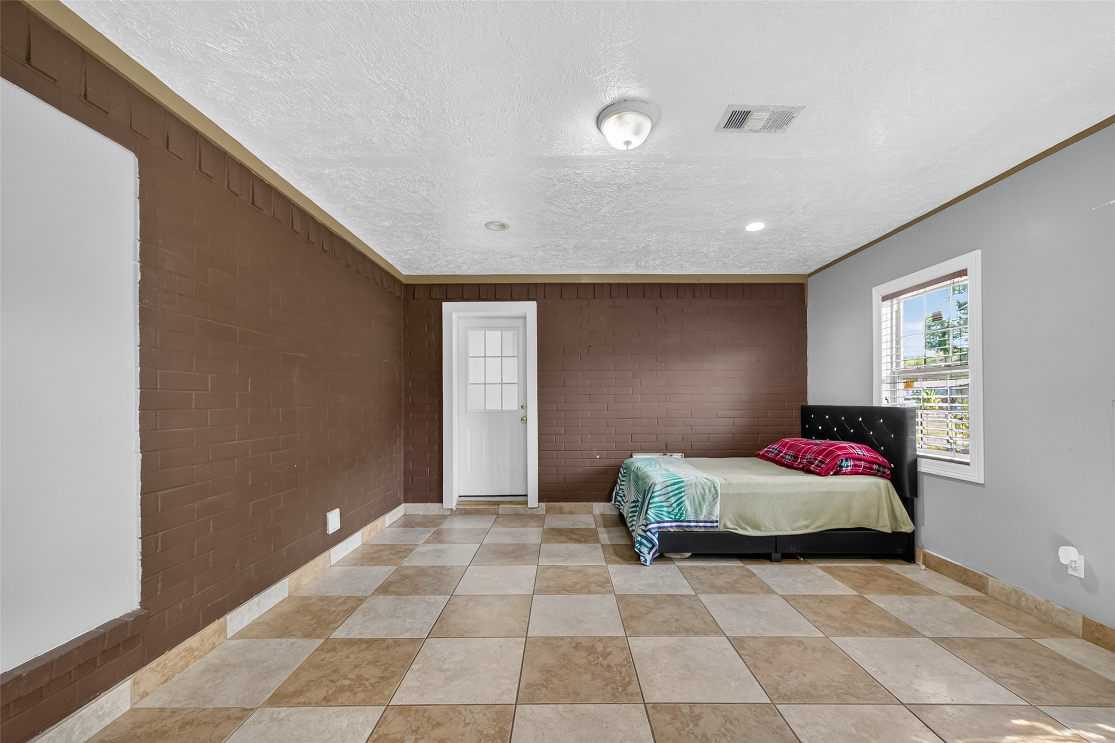 4917 Sycamore Avenue Pasadena, TX 77503 - Photo 26 of 46 a bedroom with a bed and a window