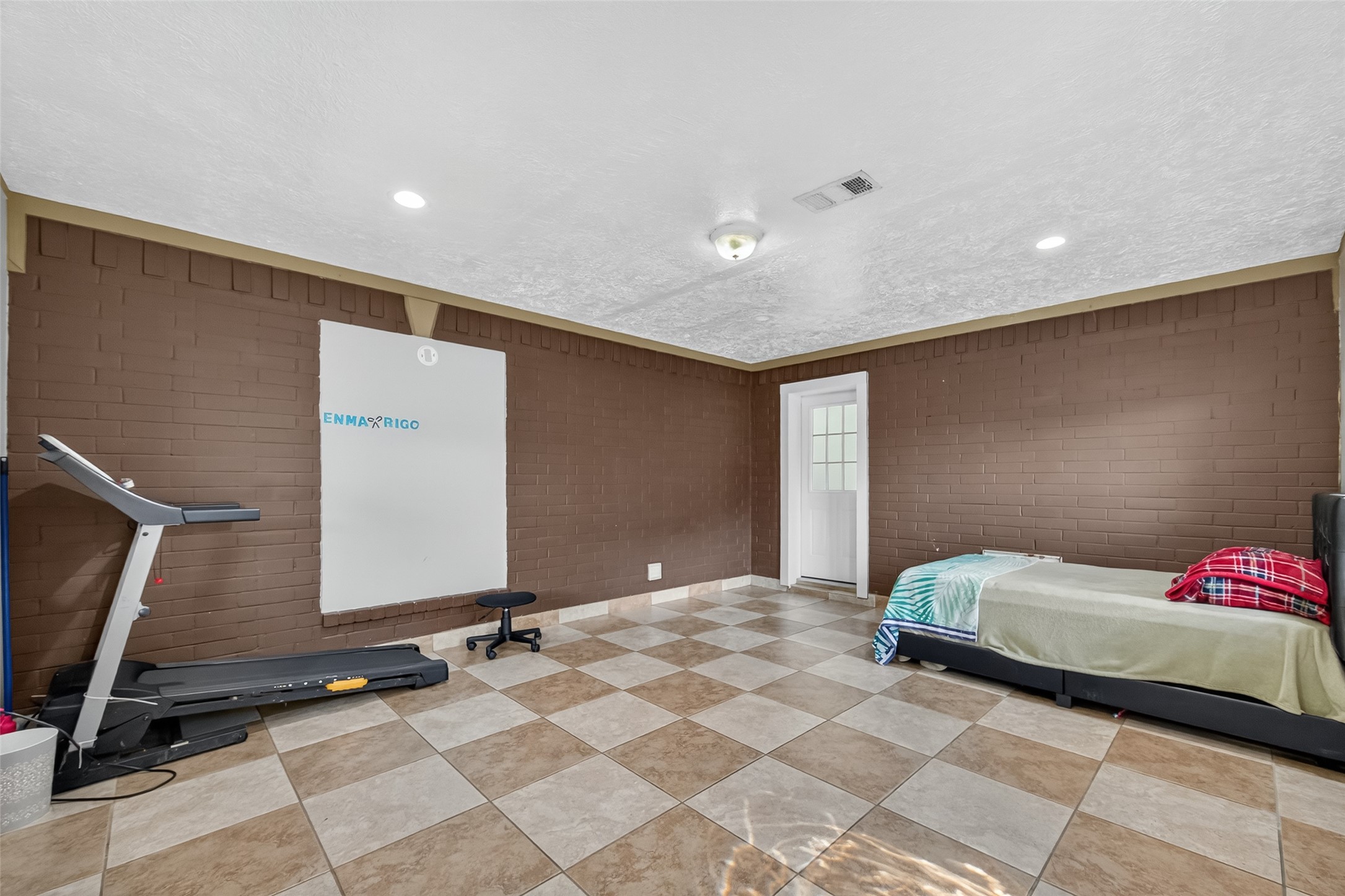 4917 Sycamore Avenue Pasadena, TX 77503 - Photo 27 of 46 a bedroom with a bed and a flat screen tv