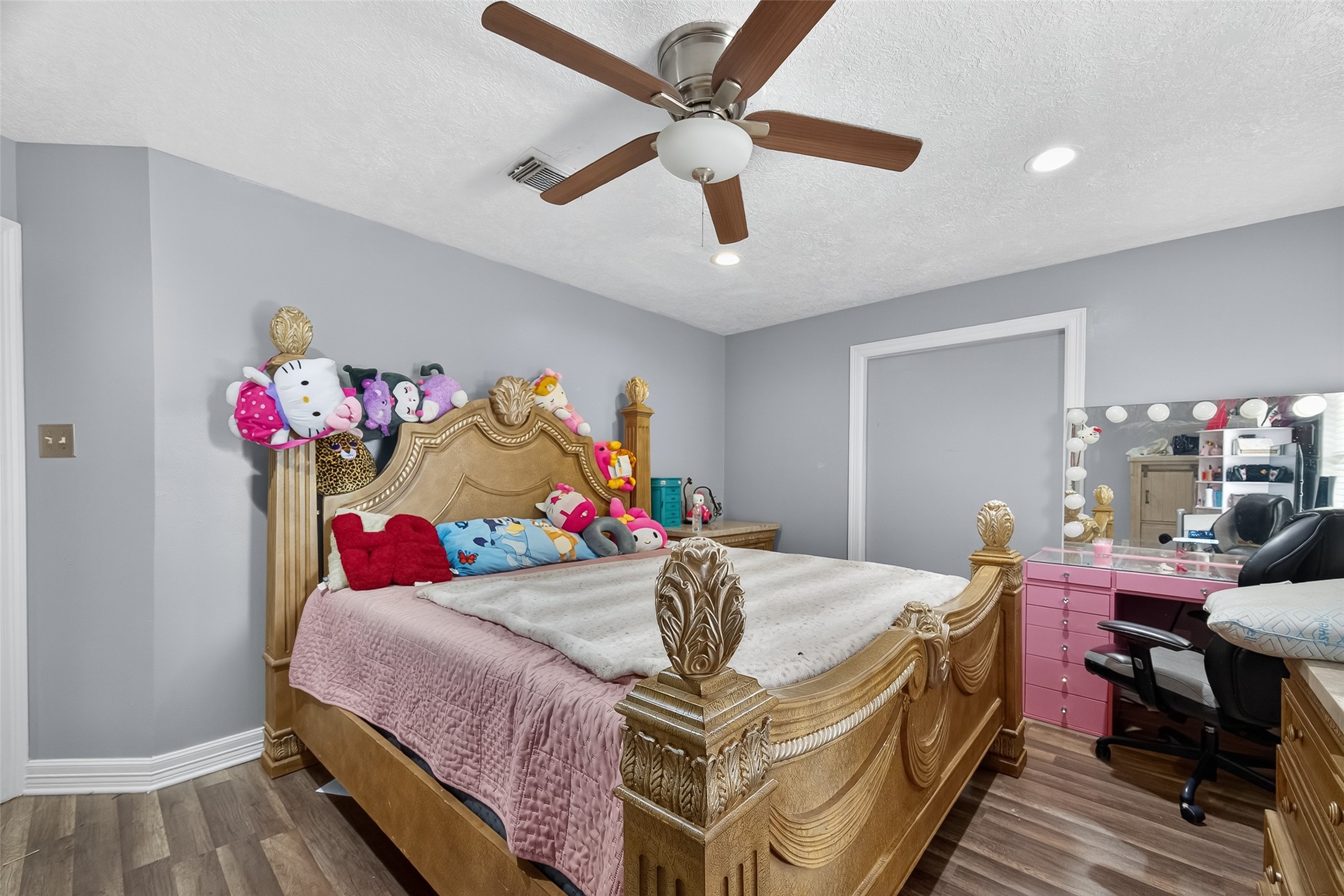 4917 Sycamore Avenue Pasadena, TX 77503 - Photo 28 of 46 a bedroom with a bed and a chandelier