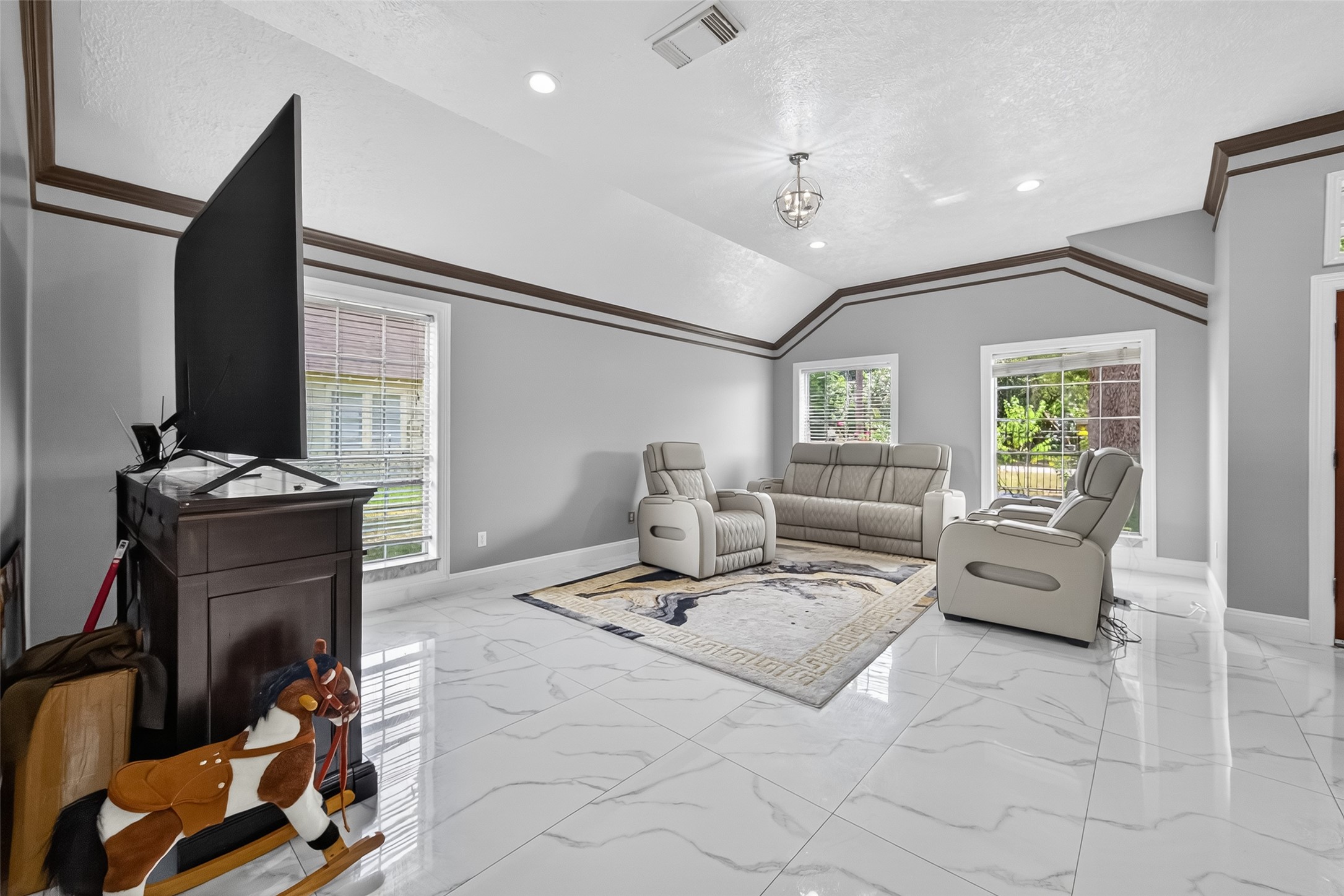 4917 Sycamore Avenue Pasadena, TX 77503 - Photo 8 of 46 a living room with furniture and a flat screen tv
