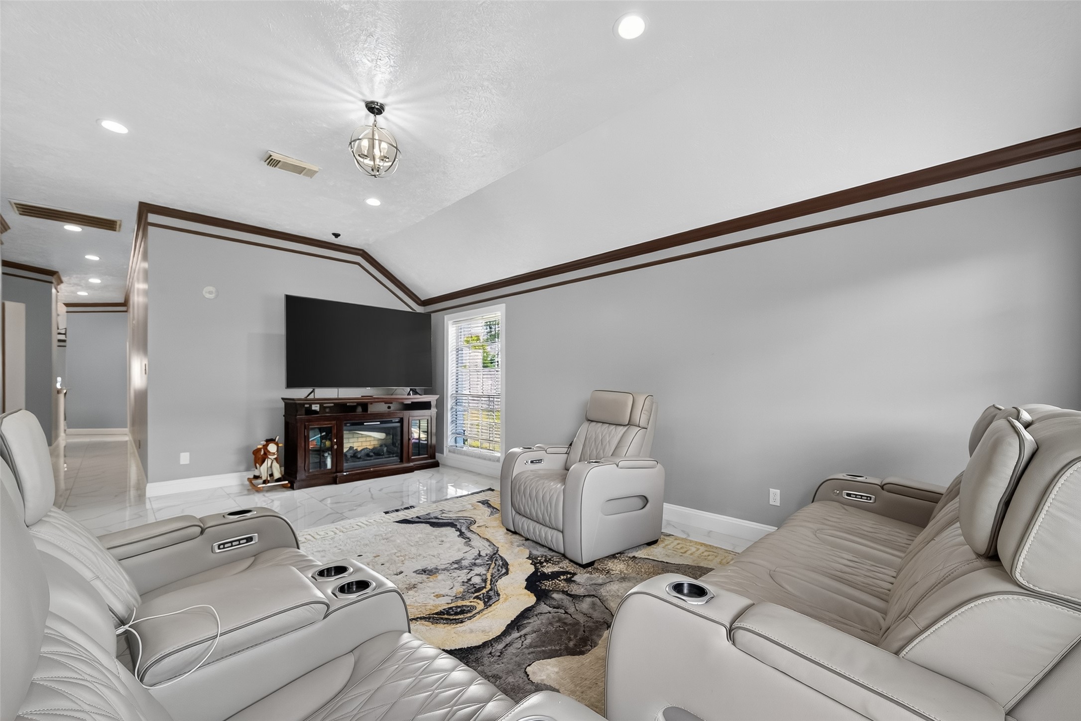 4917 Sycamore Avenue Pasadena, TX 77503 - Photo 10 of 46 a living room with furniture and a flat screen tv