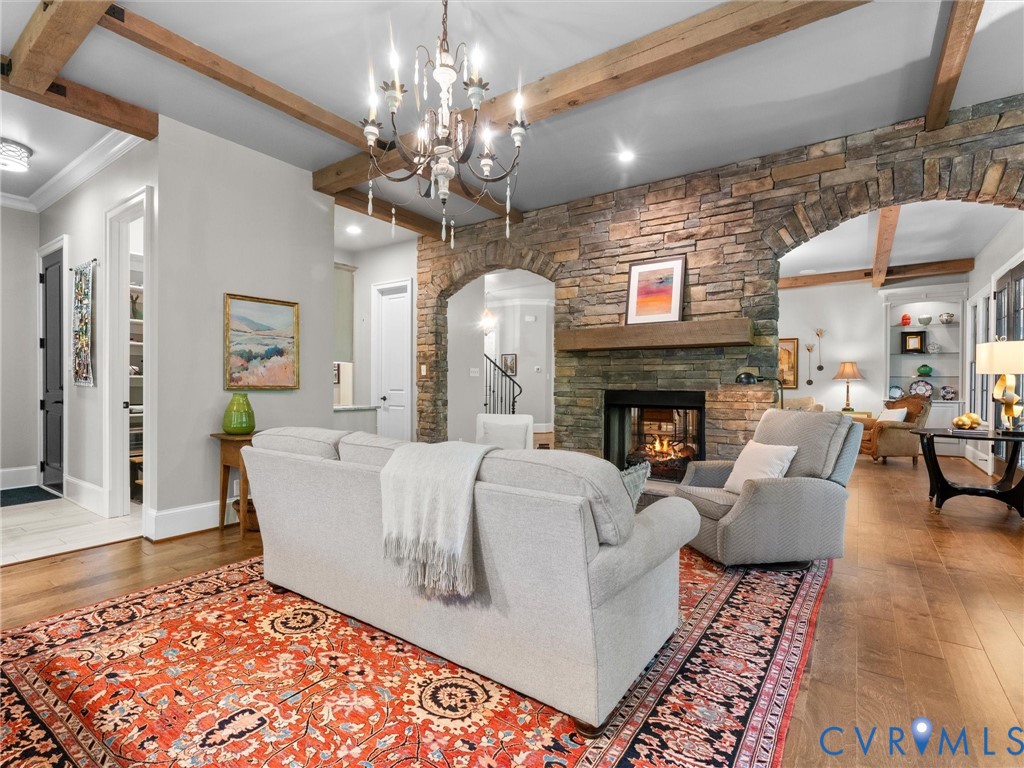 16131 Binley Road Midlothian, VA 23112 - Photo 26 of 99 a living room with fireplace furniture and a chandelier