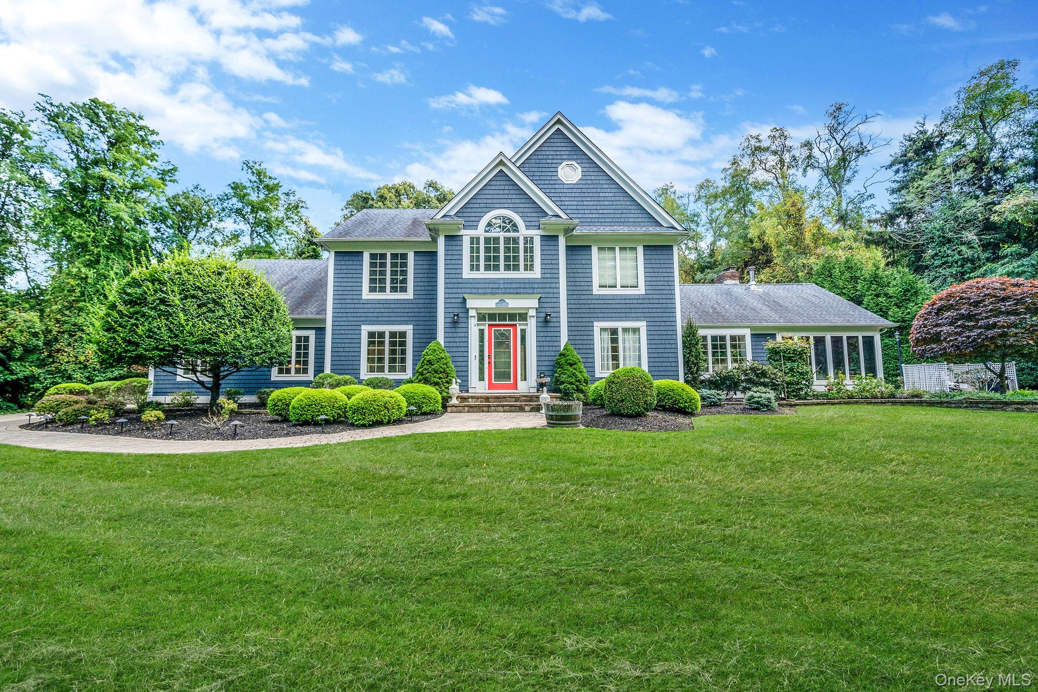 27 Tower Hill Road Shoreham, NY 11786 - Photo 1 of 49 a front view of a house with a yard