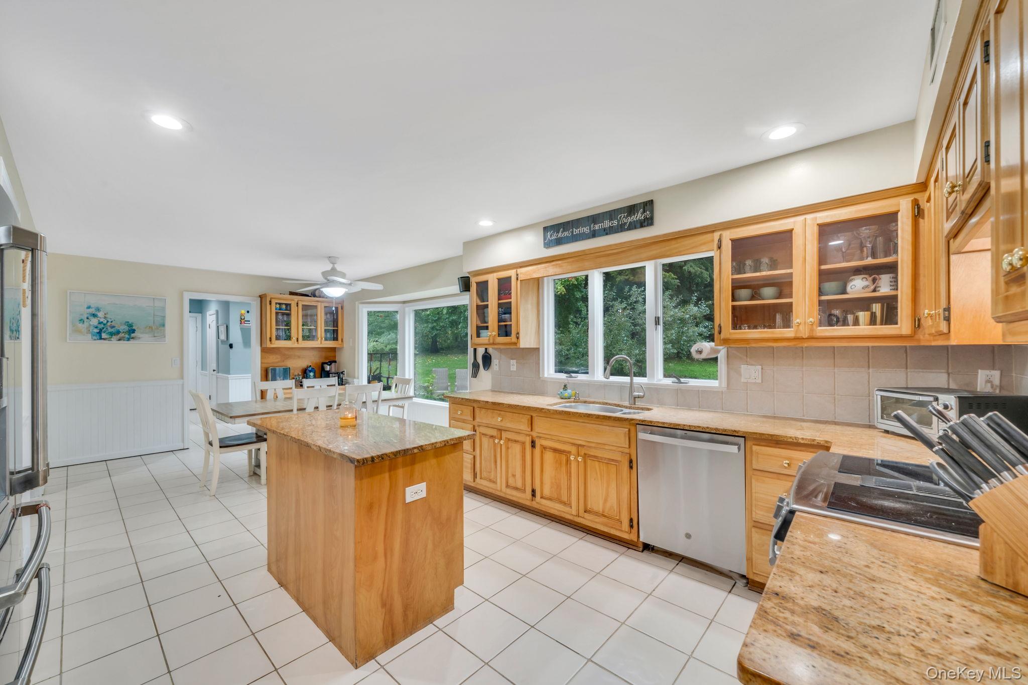 27 Tower Hill Road Shoreham, NY 11786 - Photo 13 of 49 a kitchen with a sink and cabinets