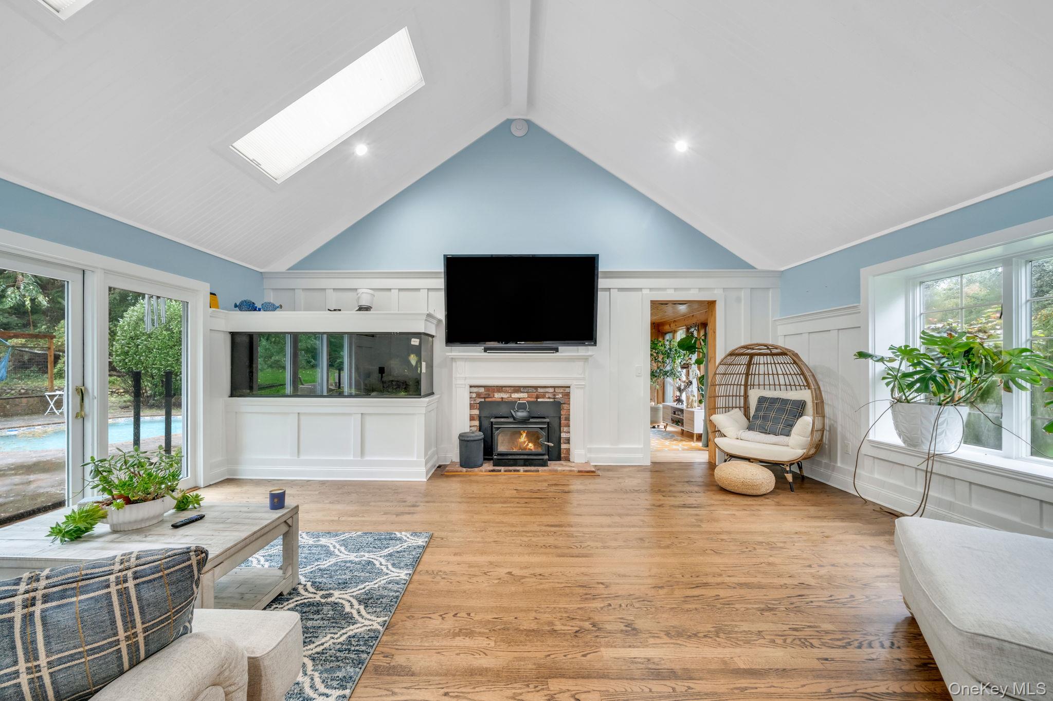 27 Tower Hill Road Shoreham, NY 11786 - Photo 14 of 49 a living room with fireplace furniture and a flat screen tv