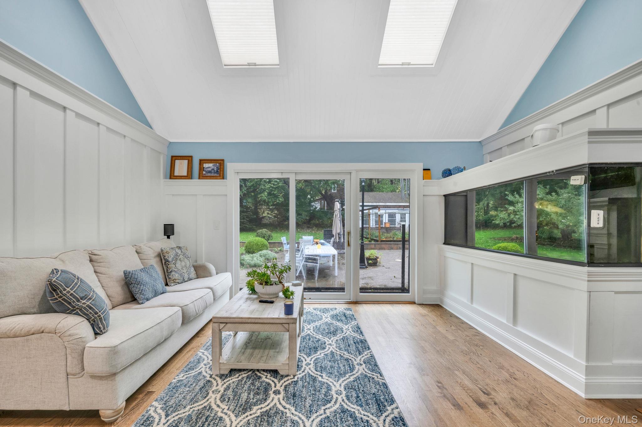 27 Tower Hill Road Shoreham, NY 11786 - Photo 15 of 49 a living room with furniture fireplace and large windows