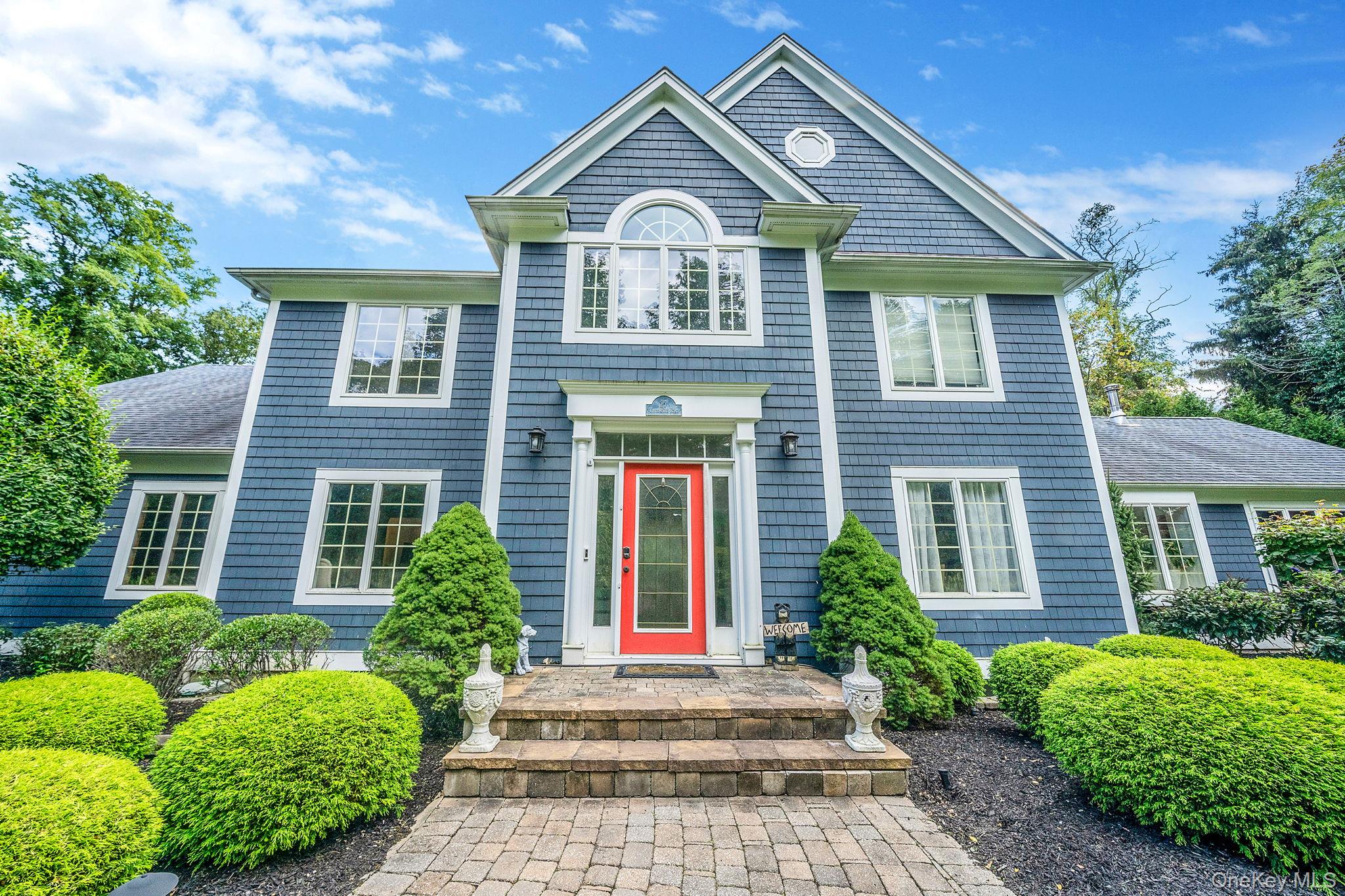 27 Tower Hill Road Shoreham, NY 11786 - Photo 2 of 49 a front view of a house with garden