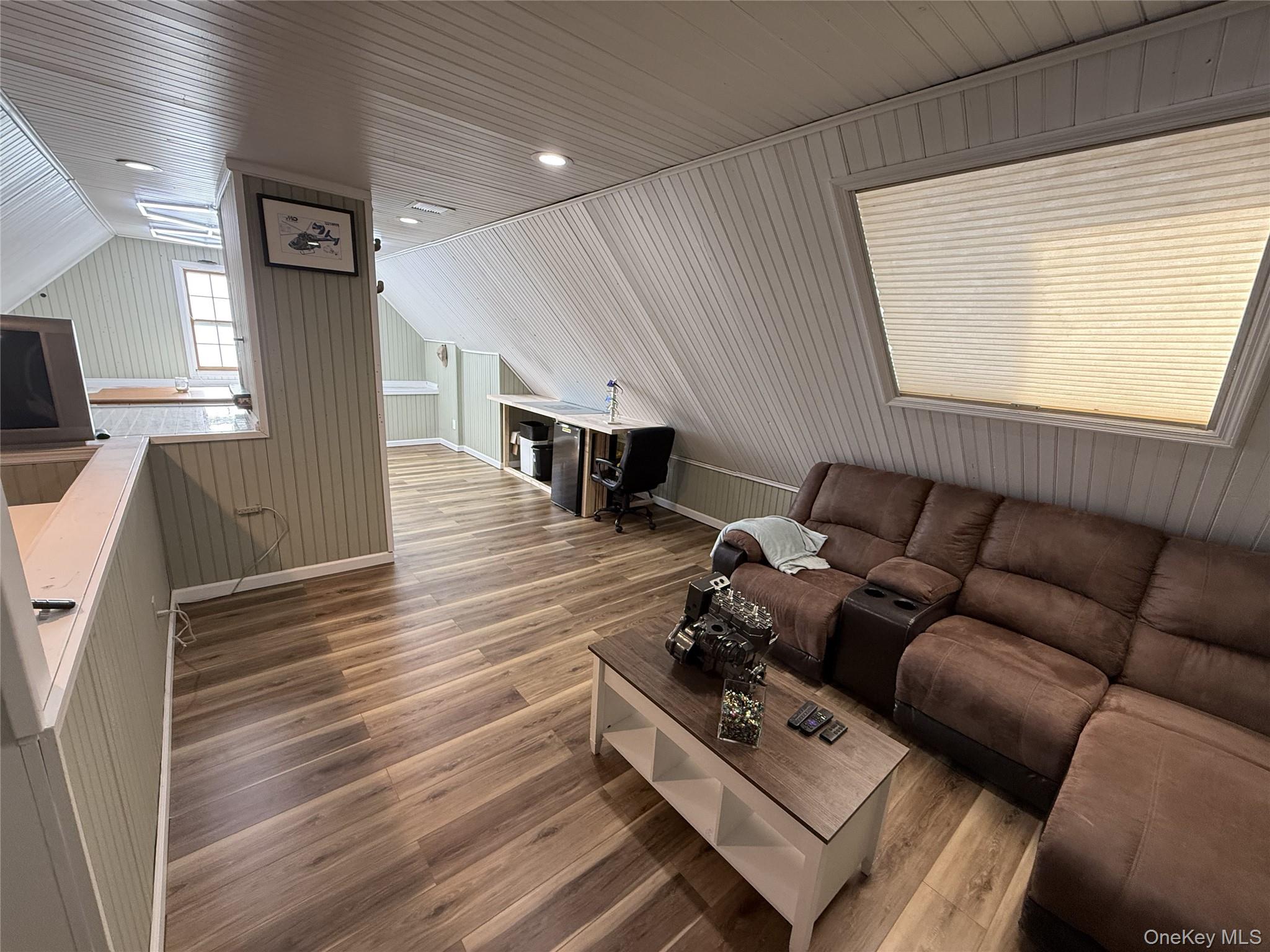 27 Tower Hill Road Shoreham, NY 11786 - Photo 23 of 49 a living room with furniture and a flat screen tv