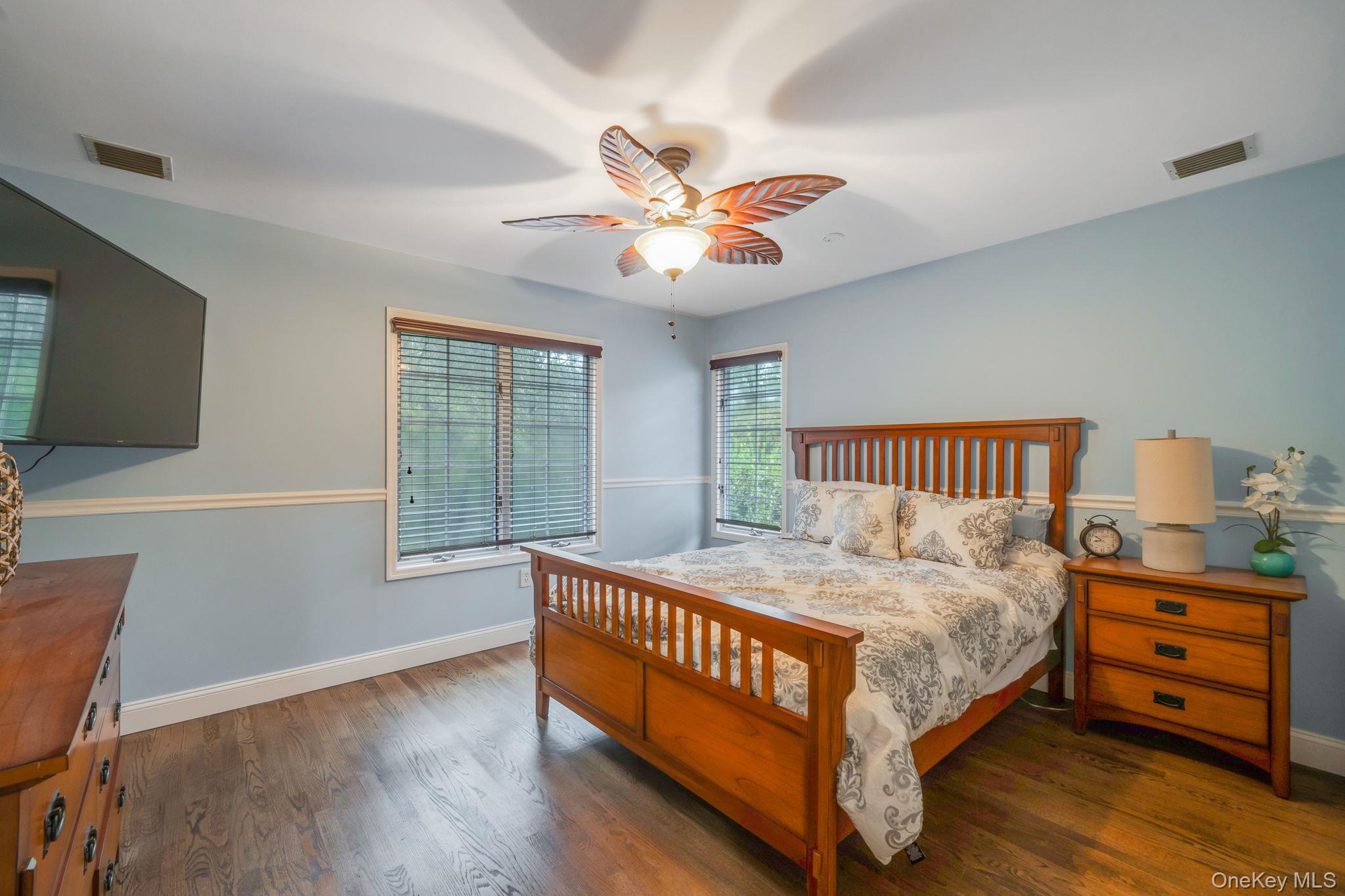 27 Tower Hill Road Shoreham, NY 11786 - Photo 28 of 49 a bedroom with a bed and a tv on table