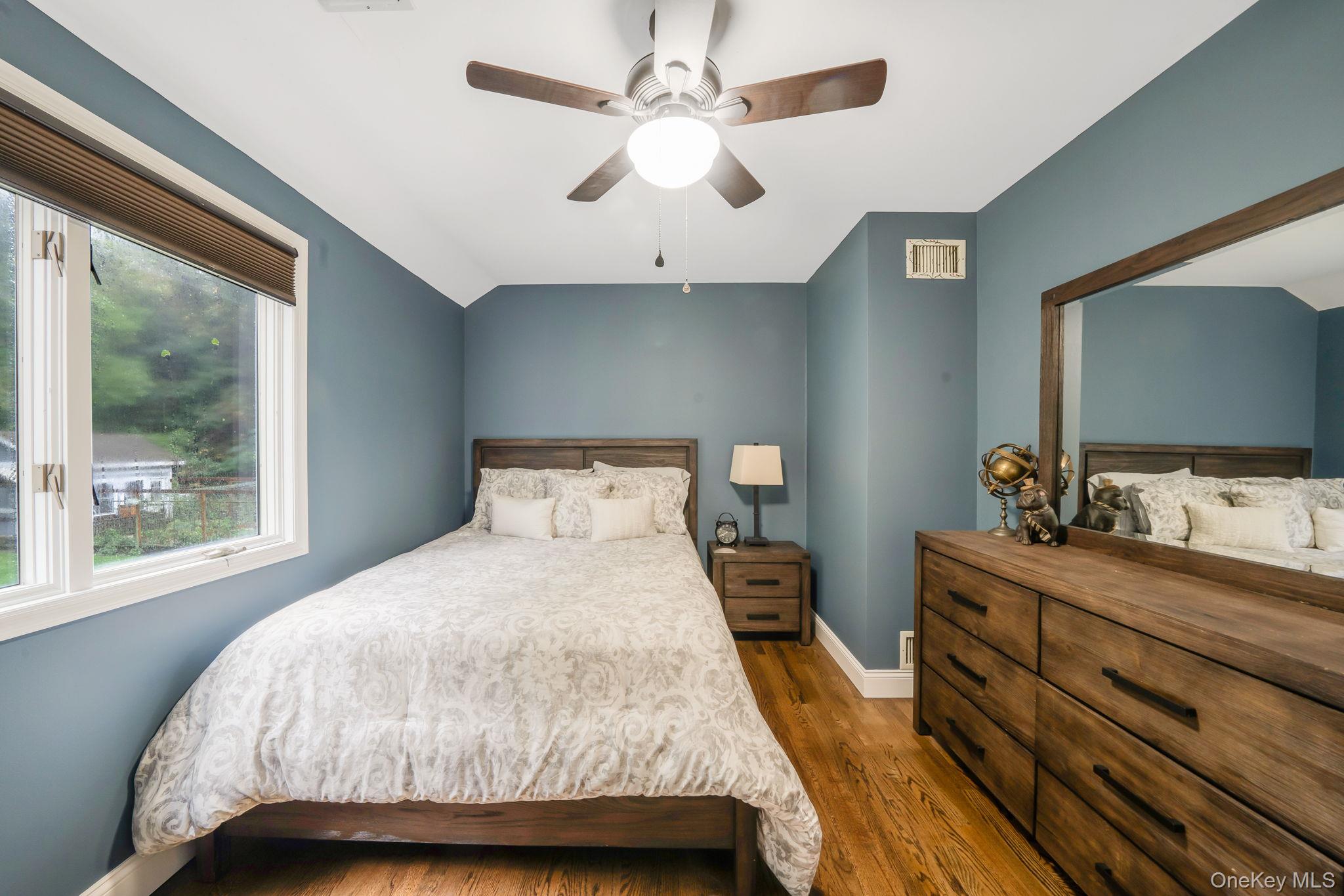 27 Tower Hill Road Shoreham, NY 11786 - Photo 29 of 49 a bedroom with a bed and a flat screen tv