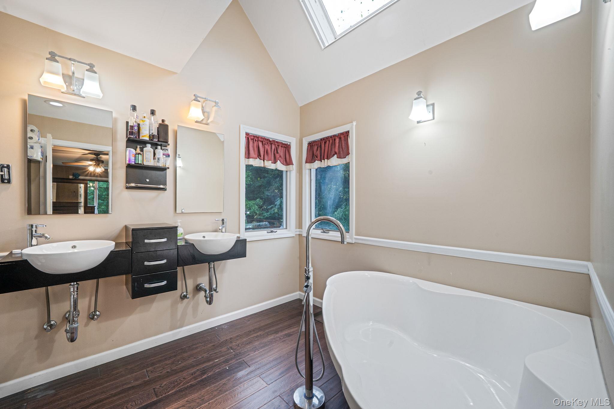 27 Tower Hill Road Shoreham, NY 11786 - Photo 33 of 49 a bathroom with a bathtub and a sink