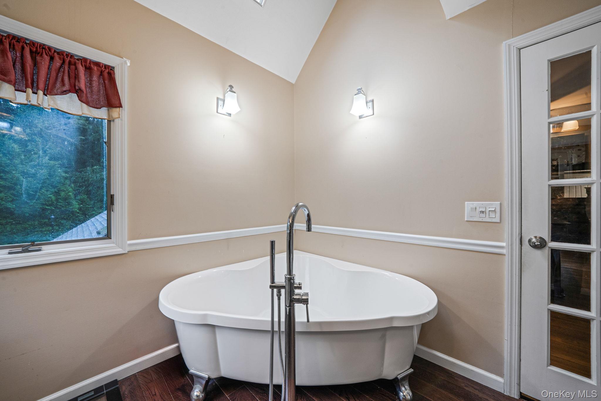27 Tower Hill Road Shoreham, NY 11786 - Photo 34 of 49 a white bath tub sitting in a bathroom