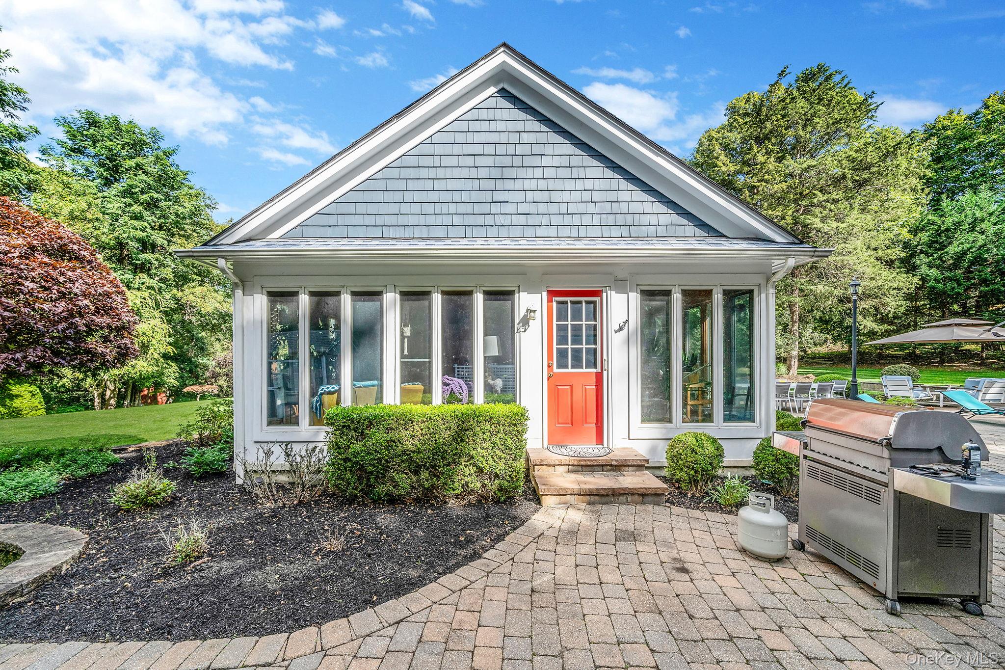 27 Tower Hill Road Shoreham, NY 11786 - Photo 40 of 49 a front view of a house with garden