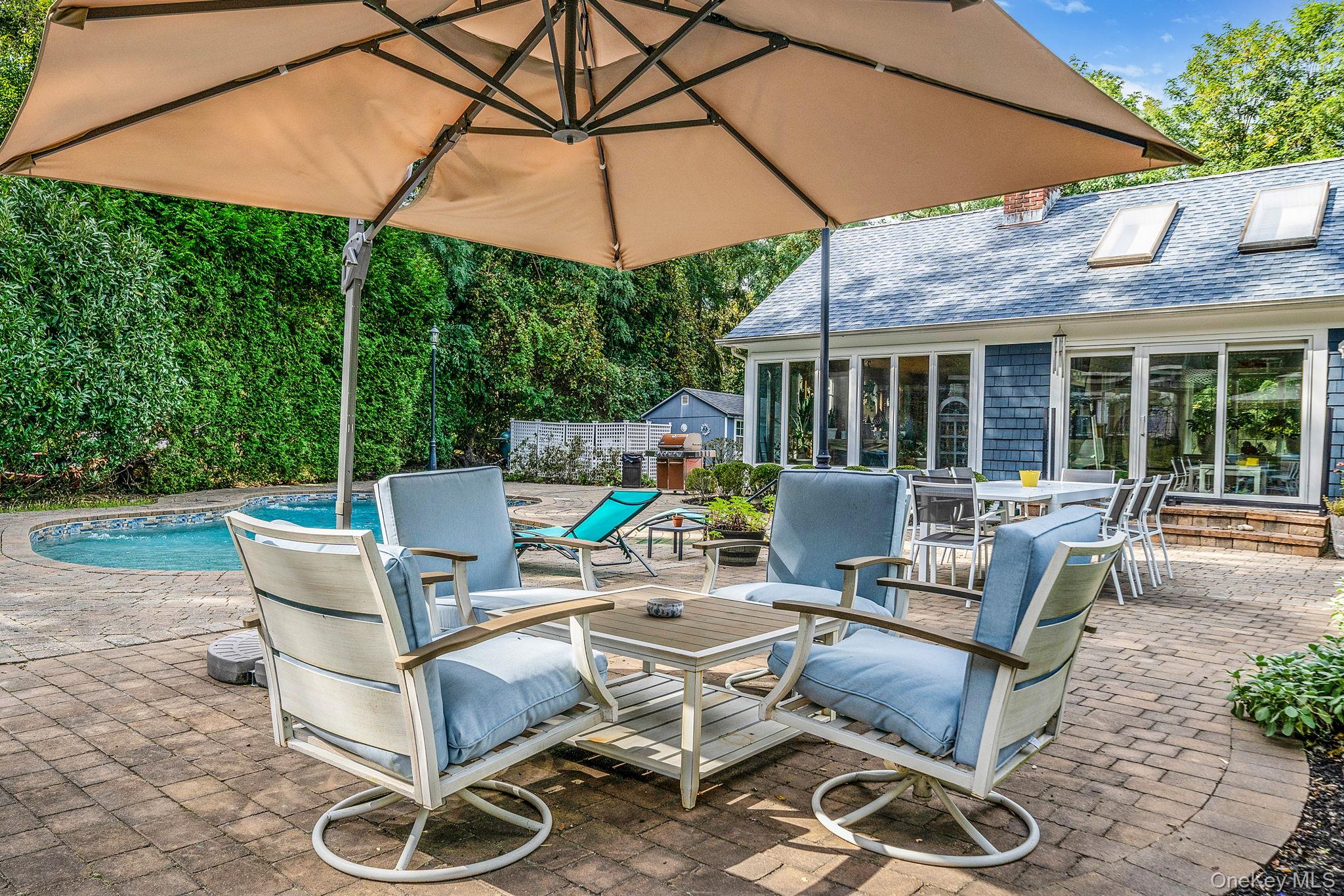 27 Tower Hill Road Shoreham, NY 11786 - Photo 42 of 49 a building outdoor space with patio furniture and potted plants