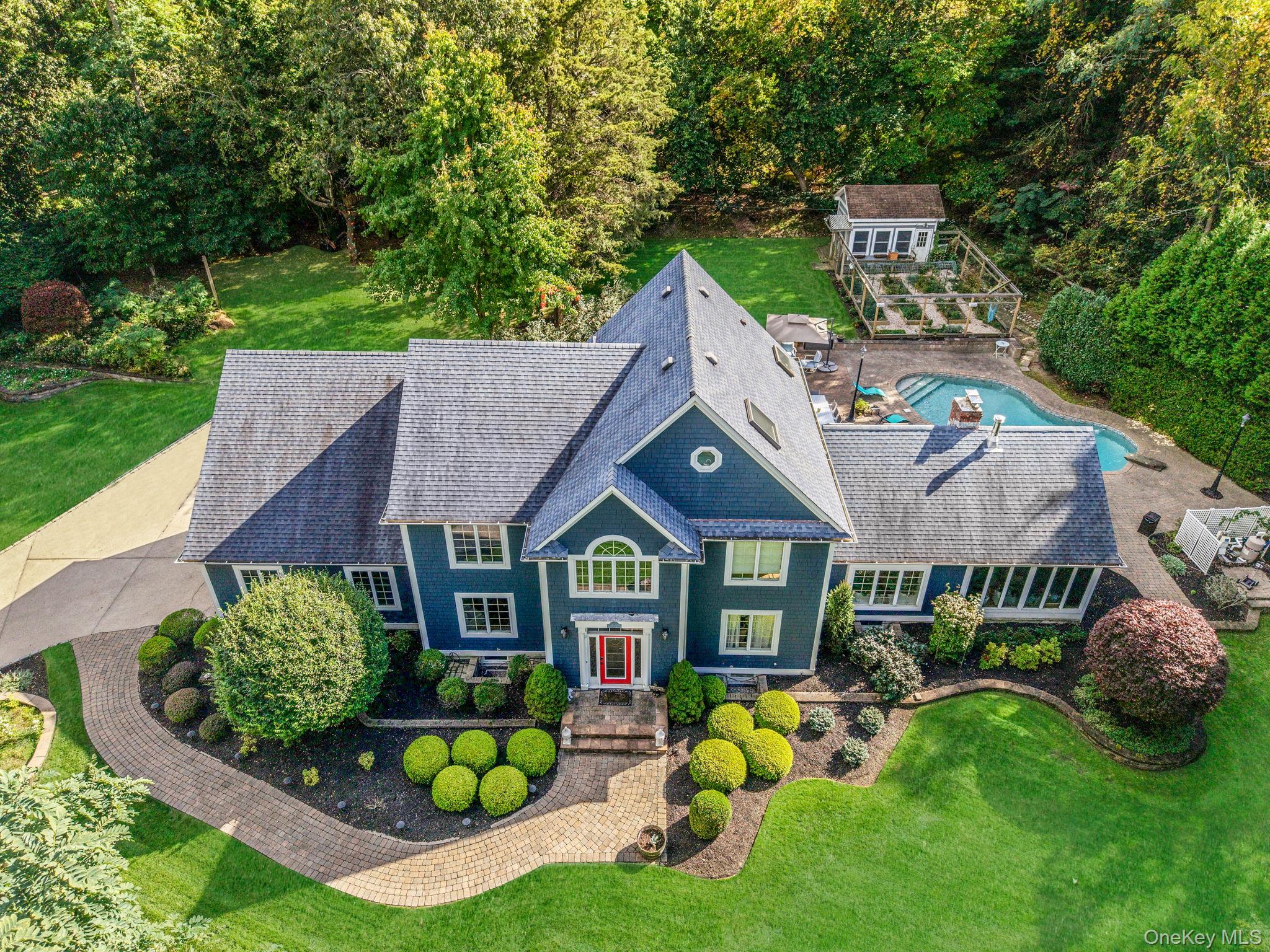 27 Tower Hill Road Shoreham, NY 11786 - Photo 44 of 49 a aerial view of a table and chairs in patio