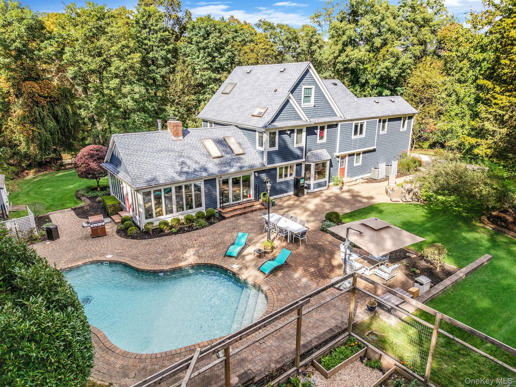 27 Tower Hill Road Shoreham, NY 11786 - Photo 49 of 49 an aerial view of a house with swimming pool and outdoor seating