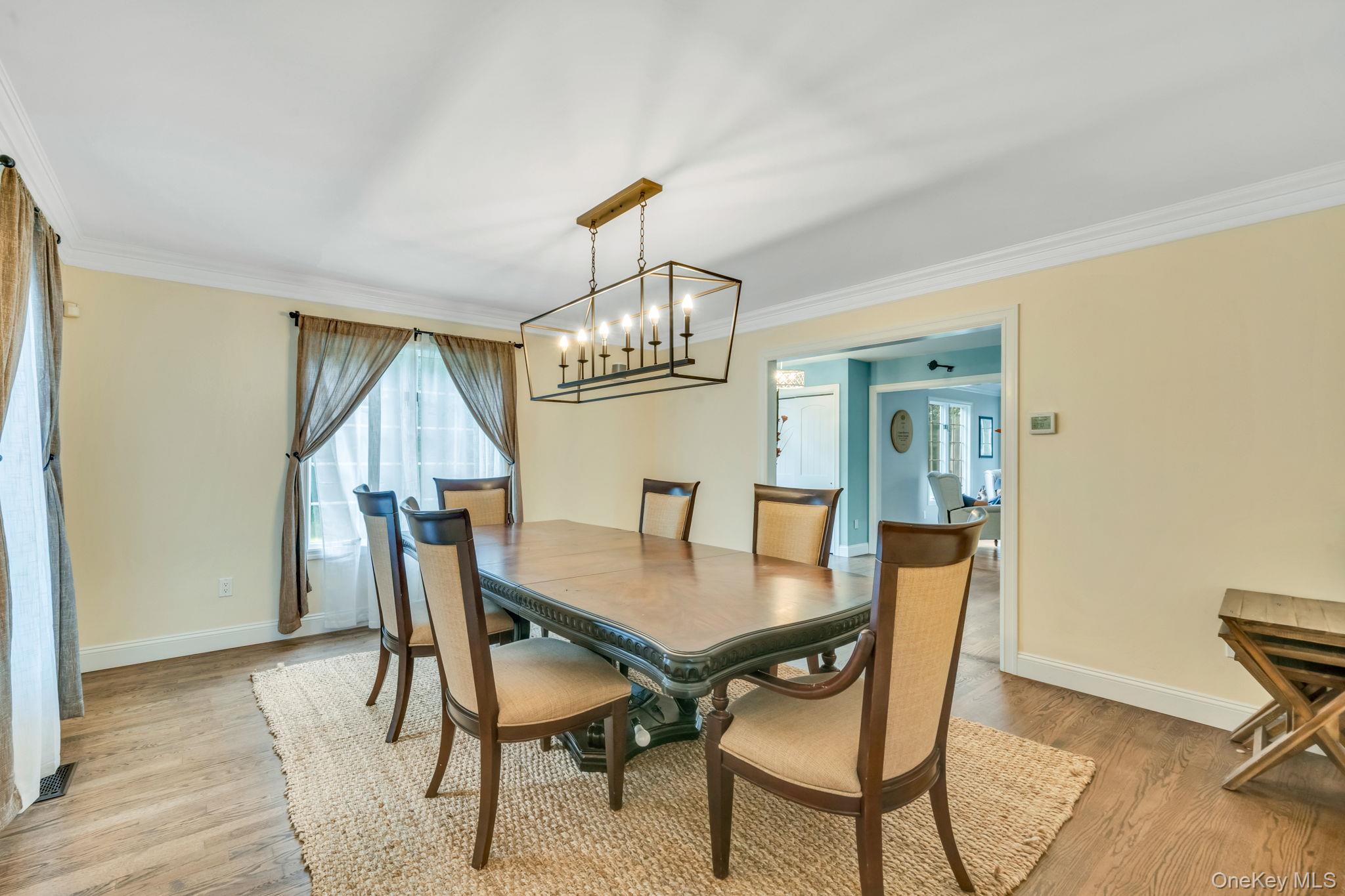 27 Tower Hill Road Shoreham, NY 11786 - Photo 7 of 49 a view of a dining room with furniture window and wooden floor