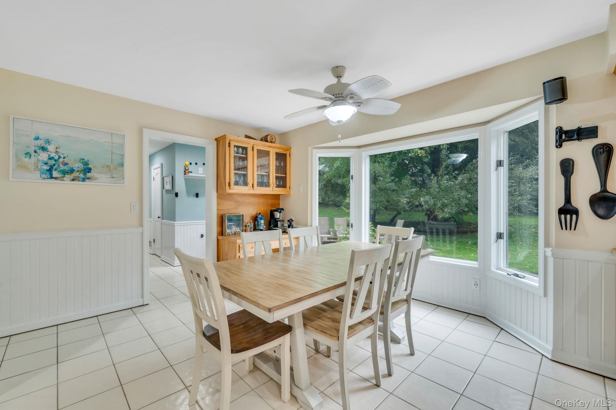 27 Tower Hill Road Shoreham, NY 11786 - Photo 9 of 49 a view of a dining room with furniture window and outside view