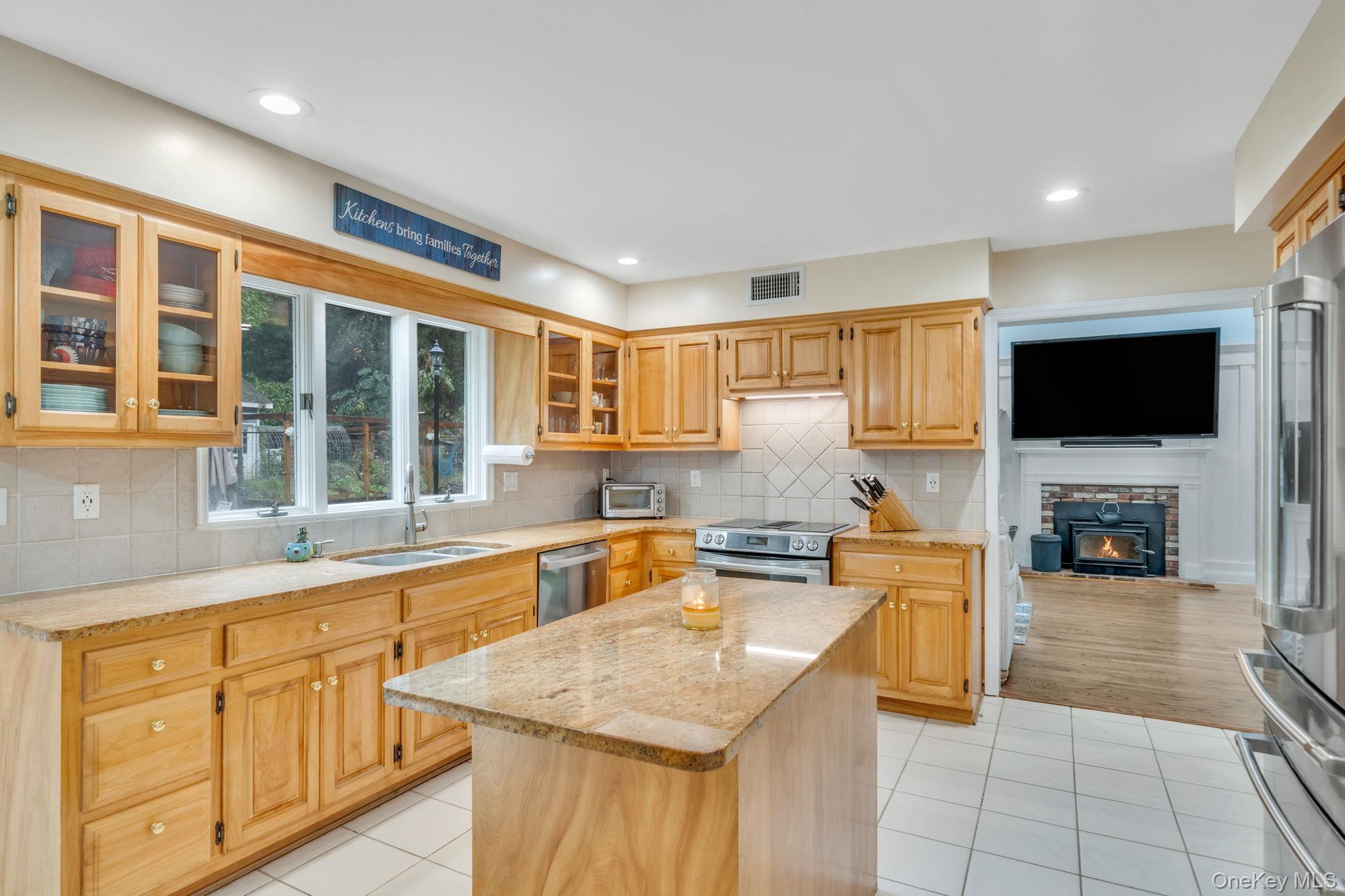 27 Tower Hill Road Shoreham, NY 11786 - Photo 10 of 49 a kitchen with stainless steel appliances granite countertop a sink and cabinets