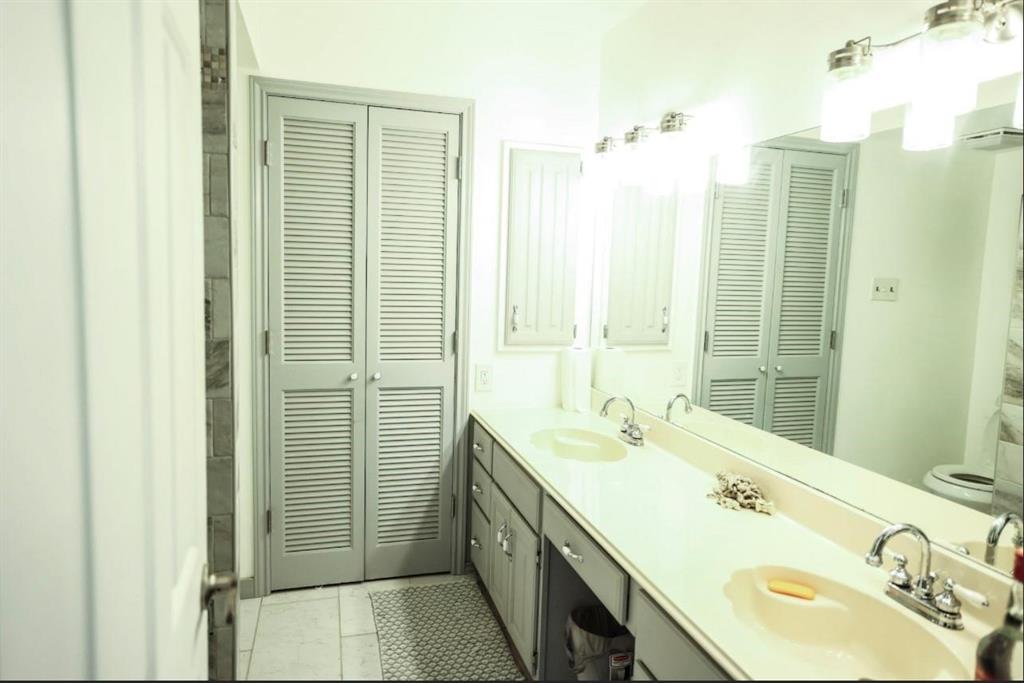 3439 South 271 Bonham, TX 75418 - Photo 13 of 36 a bathroom with a double vanity sink and a mirror