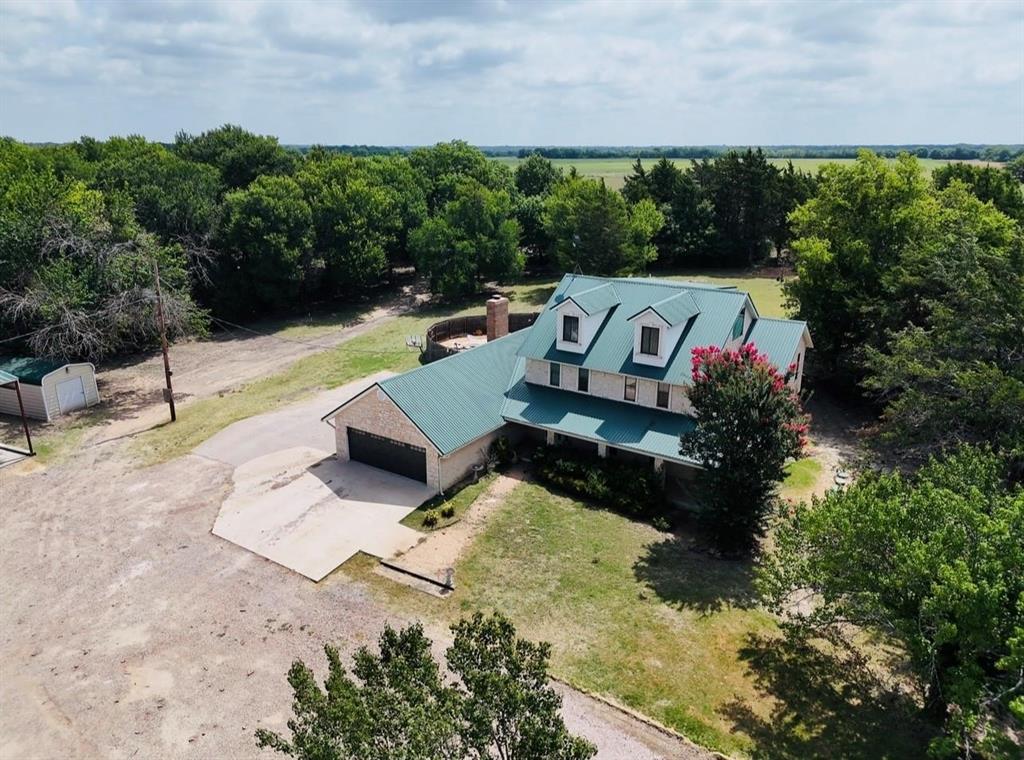 3439 South 271 Bonham, TX 75418 - Photo 27 of 36 a view of swimming pool with seating space and trees in the background