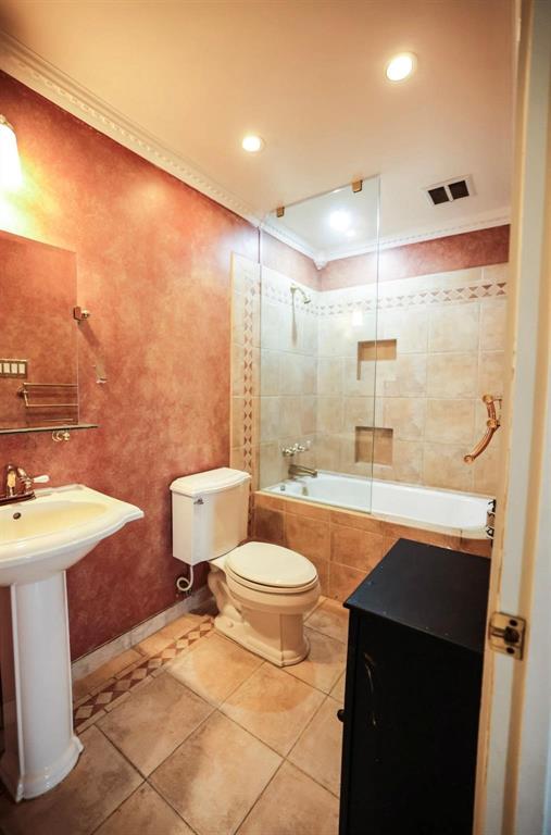 3439 South 271 Bonham, TX 75418 - Photo 10 of 36 a bathroom with a sink a toilet a mirror and shower