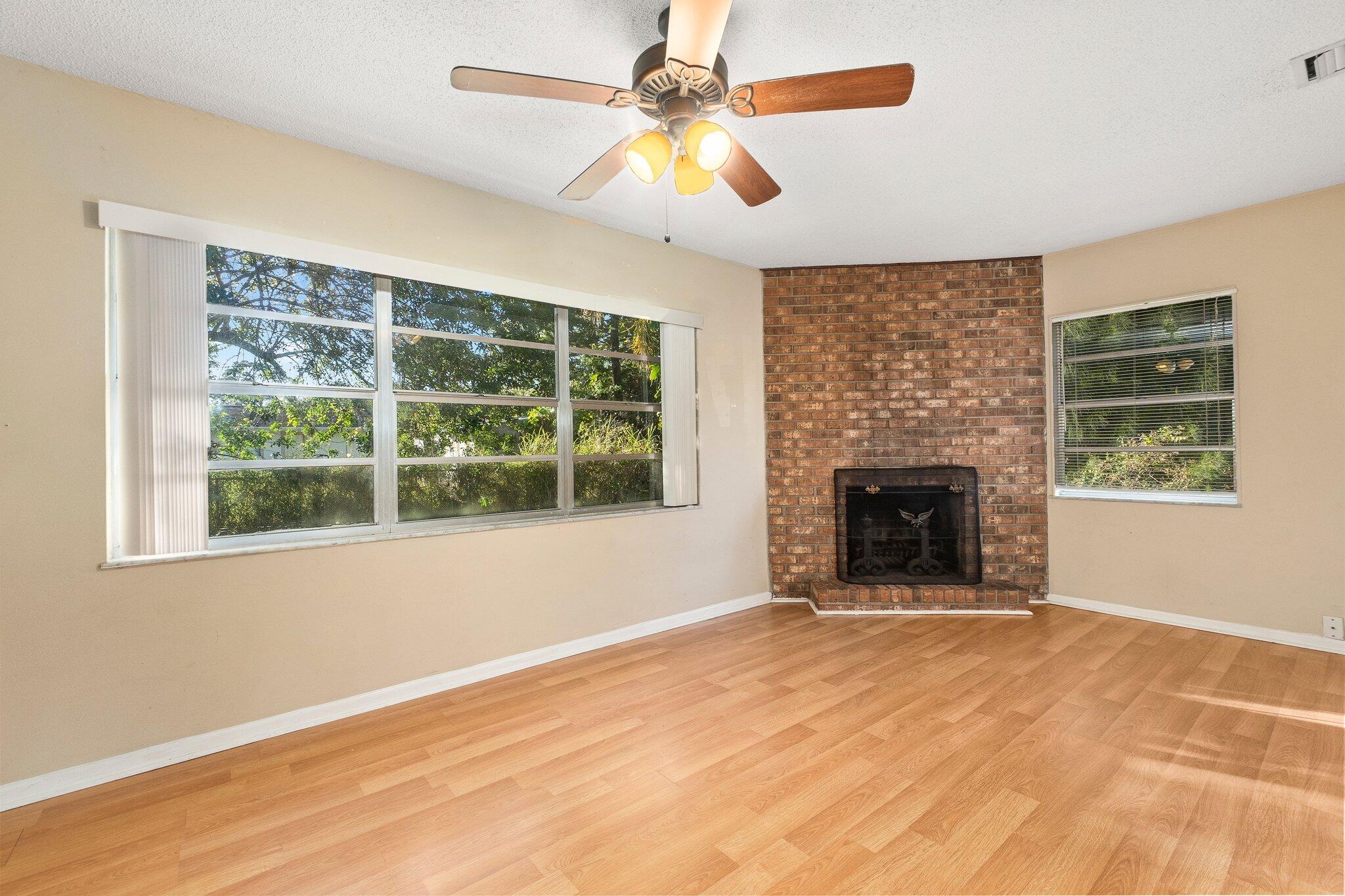 5901 Sunset Boulevard Fort Pierce, FL 34982 - Photo 14 of 26 a view of an empty room with window and a fireplace